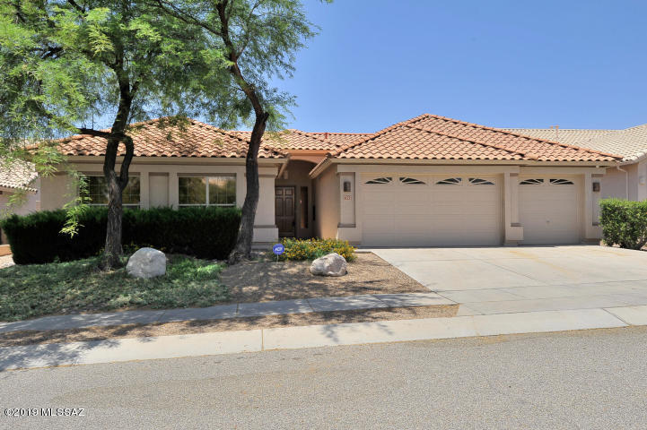 Great District 16 location near Sabino Canyon with mountain view lot bordering a natural greenbelt area. This 4 bedroom, 2.5 bath, plus office/den home features large covered patio, sparkling pool with rock waterfall, built in gas bbq and inviting landscaping.Beautiful kitchen with cooktop range & maple cabinets. The kitchen opens to the spacious family room with gas fireplace. The open living room/ dining room has a vaulted ceiling and ample room to entertain. The oversized Master features large windows, vaulted ceilings, French door to patio and a large Master bathroom with large walk-in closet. The guest bedroom wing is split from the master. Spacious 3 car garage