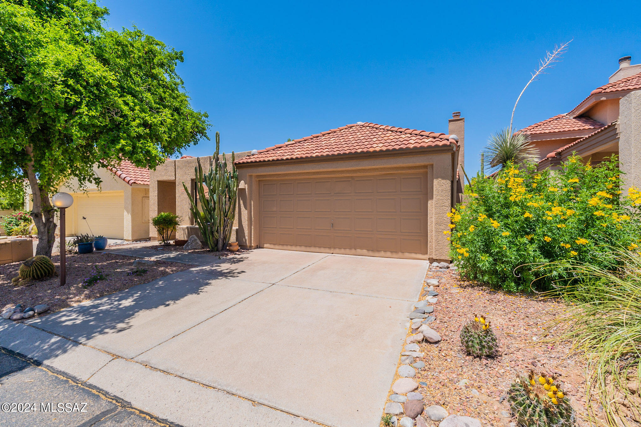 You won't want to miss this Beautiful, updated, one-owner home in the highly sought after Community of Villa Balboa, tucked away, but close to all amenities Oro Valley has to offer! Tree and lamp-lined streets Welcome you Home! This popular 1530 sf plan shows beautifully and has been lovingly maintained.  Updated kitchen with Quartz countertops, SS GE appliance pkg. Tile throughout! Large owner's suite with patio slider, large W/I closet, plus a 2nd closet, dual lavs and tub/shower. Split floor plan. 3rd Bedroom makes a perfect office, den or flex room. Lovely, low maintenance backyard. The Community offers an updated pool/spa area with Ramada & mountain views, as well as garbage collection & front yard landscaping. Close to Oracle corridor for easy commuting.