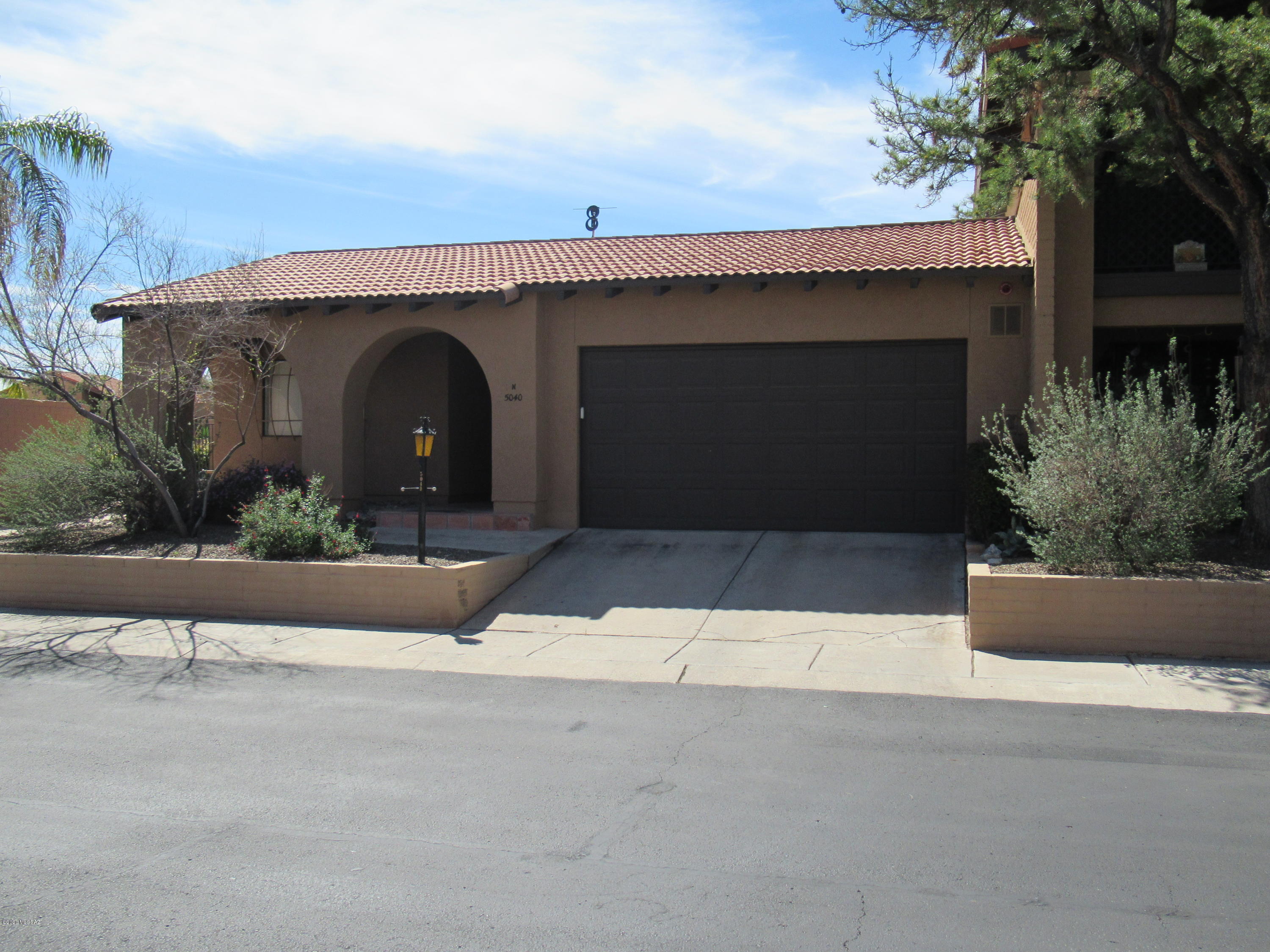 Really Sharp and contemporary mid-town townhome! Move in condition with lot's of handsome updates and upgrades! Small well cared for subdivision located in the heart of our community! You will love all the windows and light. Deluxe Viking gas cook top and oven. Spacious floorplan with split bedrooms. Rich and warm wood flooring throughout ( no carpet). Captivating gas fireplace in living area. Built in shelves in master and living area. Updated bathrooms. Very private and roomy back yard space. Plenty of room for your dog! Gorgeous community pool and spa area adjacent to this ideally located home.  HOA covers maintence of all front yards. Call for appointment to see!