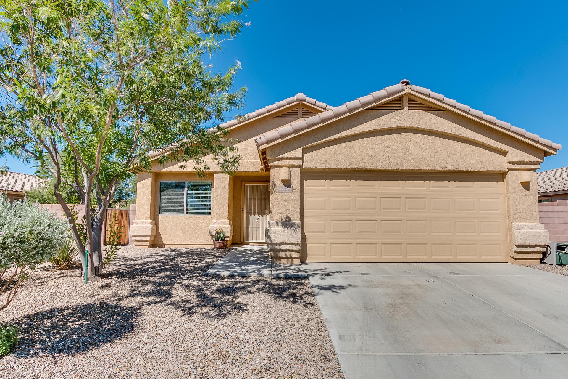 This is a beautiful single-family home conveniently located near the park and pool in the desirable community of Madera Highlands. The 1660 sq. ft. four bedroom, two bath home is light and bright with tile in the entry, kitchen, bathrooms and laundry room. The kitchen has warm maple tone cabinets, almond appliances and a breakfast bar. The master suite is in the back of the home with views of the well-manicured yard. The master bath has dual sinks, a convenient linen closet and a walk-in closet. The open concept layout, two car garage and low maintained yard make this a great opportunity for buyers looking for a tidy move in ready home. The Madera Highlands community is nestled among beautiful pecan trees with a park, pool, tennis courts and a dog park.
