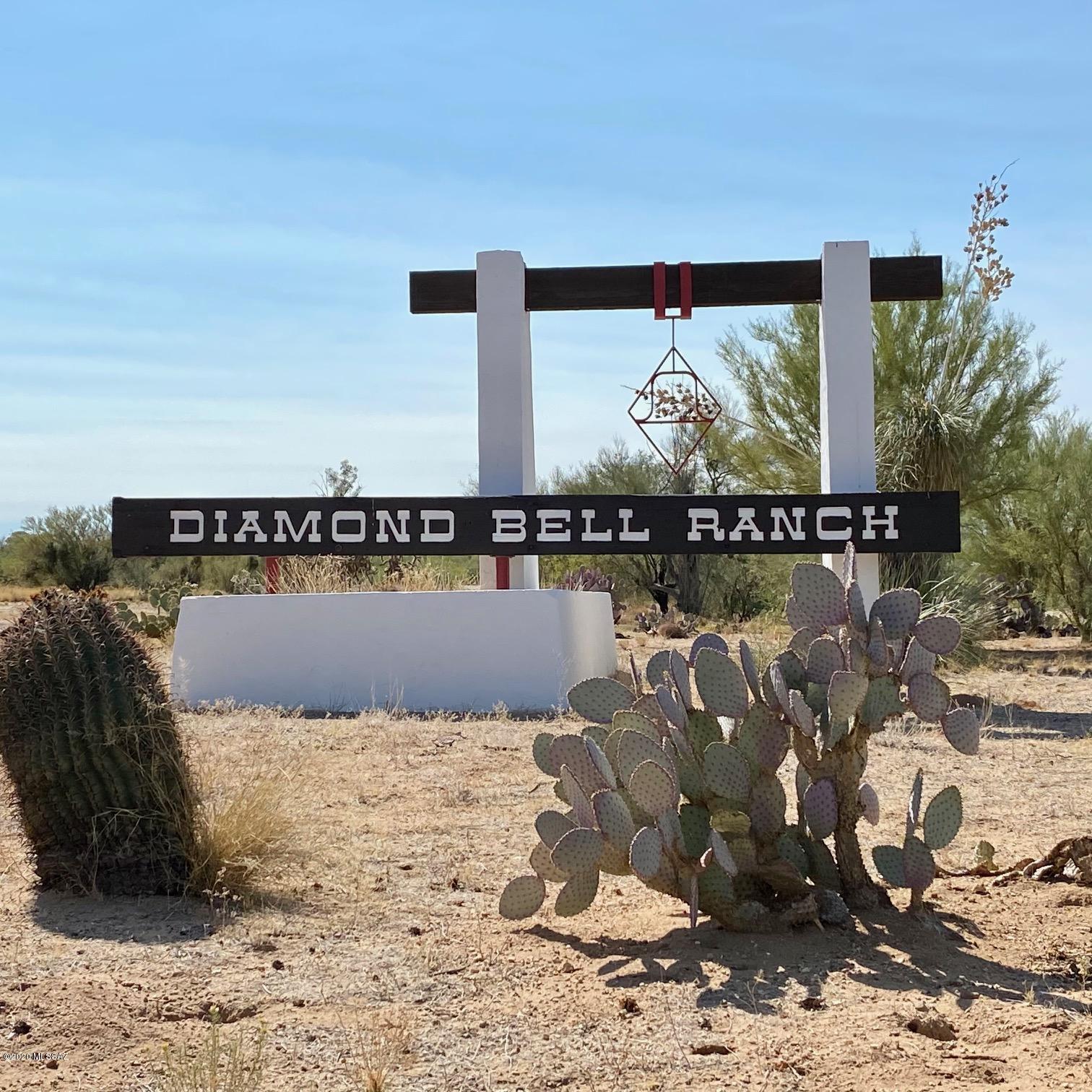 1.3 acres on paved Diamond Bell Ranch Rd.  Build your 1000 sf+ home with off the grid power.