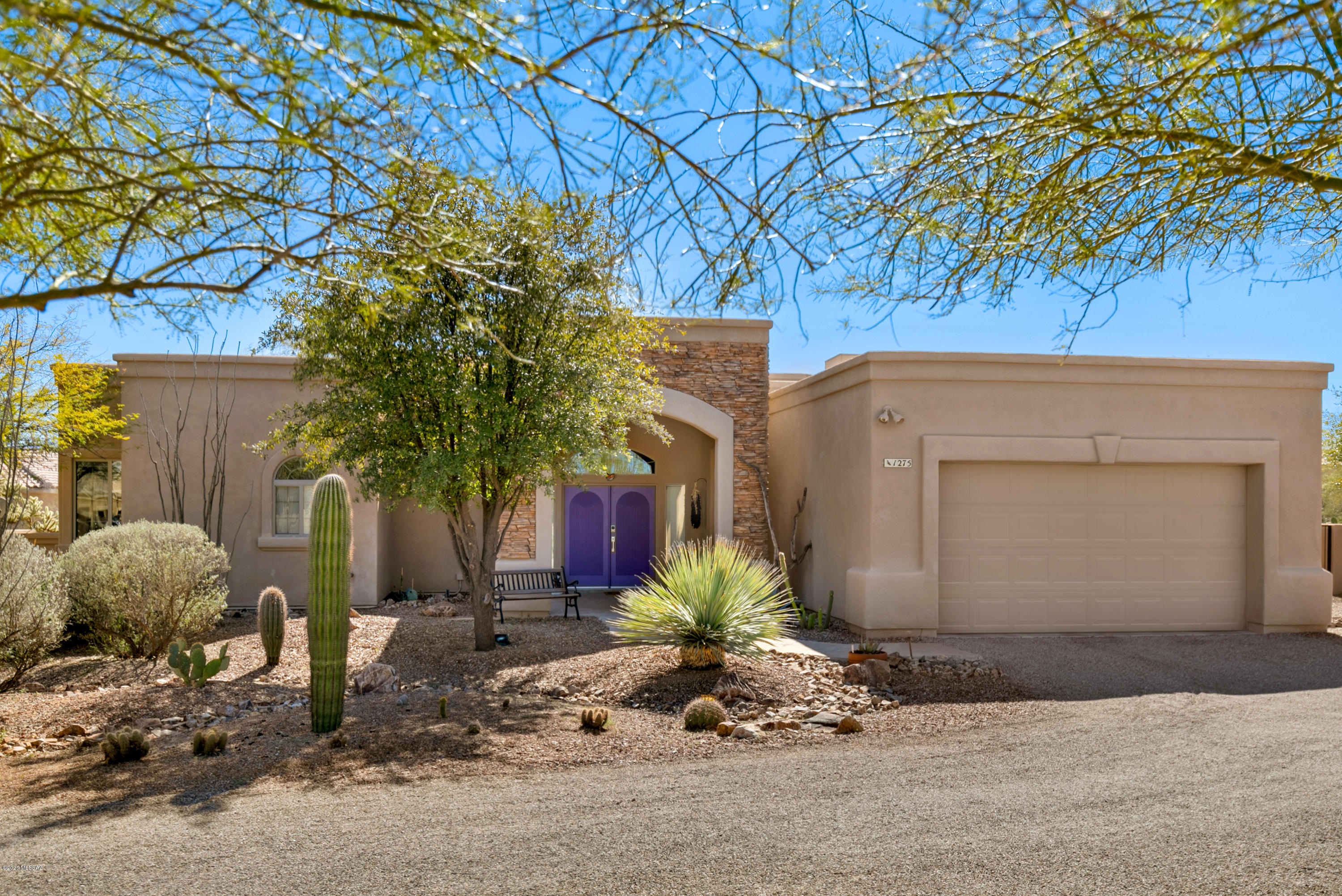 Welcome to the beautiful enclave of Bosque Dr. The festive front door greets you as you enter the tiled foyer and great room. You'll enjoy the kiva gas fireplace in the great room and the cooks kitchen with Talavera tiled counters, Cherry 41'' cabinets and stainless appliances. Tile in all areas except bedrooms, and neutral paint colors . Anderson windows throughout, His & Hers master bedroom closets, high ceilings are a few of the special touches in this lovely home.  The fountain on the back patio adds to a peaceful setting, with open desert and peek-a-boo mountain views.  R/V parking with water and electricity.  No HOA and No GVR. New water heater installed 5/3/20.