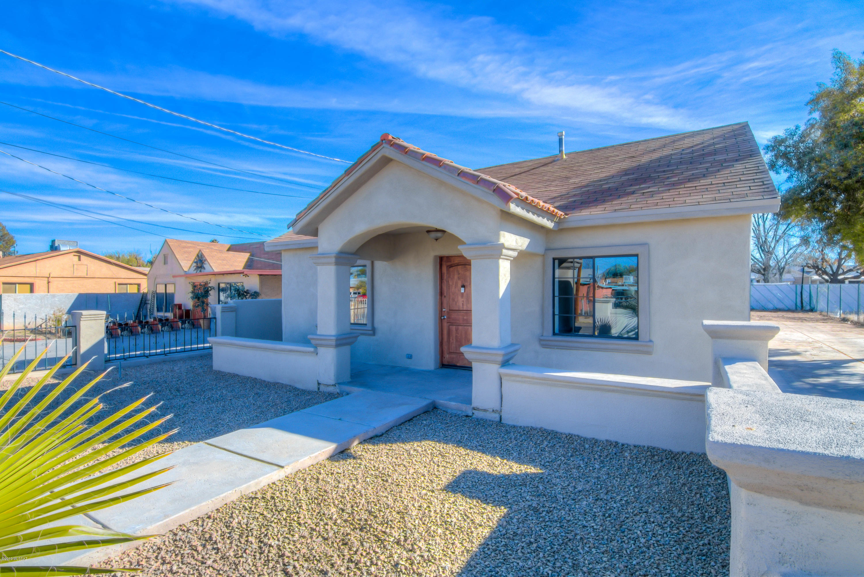 This MOVE IN READY has been remodeled and is ready for you NOW! Amazing entry and front patio welcome you into this two bed, one bath home that has loads of future potential. Front living and dining area open to the kitchen which includes bar-top seating, recessed lighting, and plenty of cabinet space. One bedroom is tiled and the master bedroom has its own mini-split AC for custom comfort, and all have new ceiling fans. The spacious bathroom boasts updated fixtures and a tile shower surround., and the oversized laundry room has plenty of space for folding clothes, using a spare refrigerator or freezer, and also has a brand-new utility sink! Lot is zoned R-2 to allow for another residence and the generous lot size gives plenty of building options. Call for a showing today! Agent/Owner