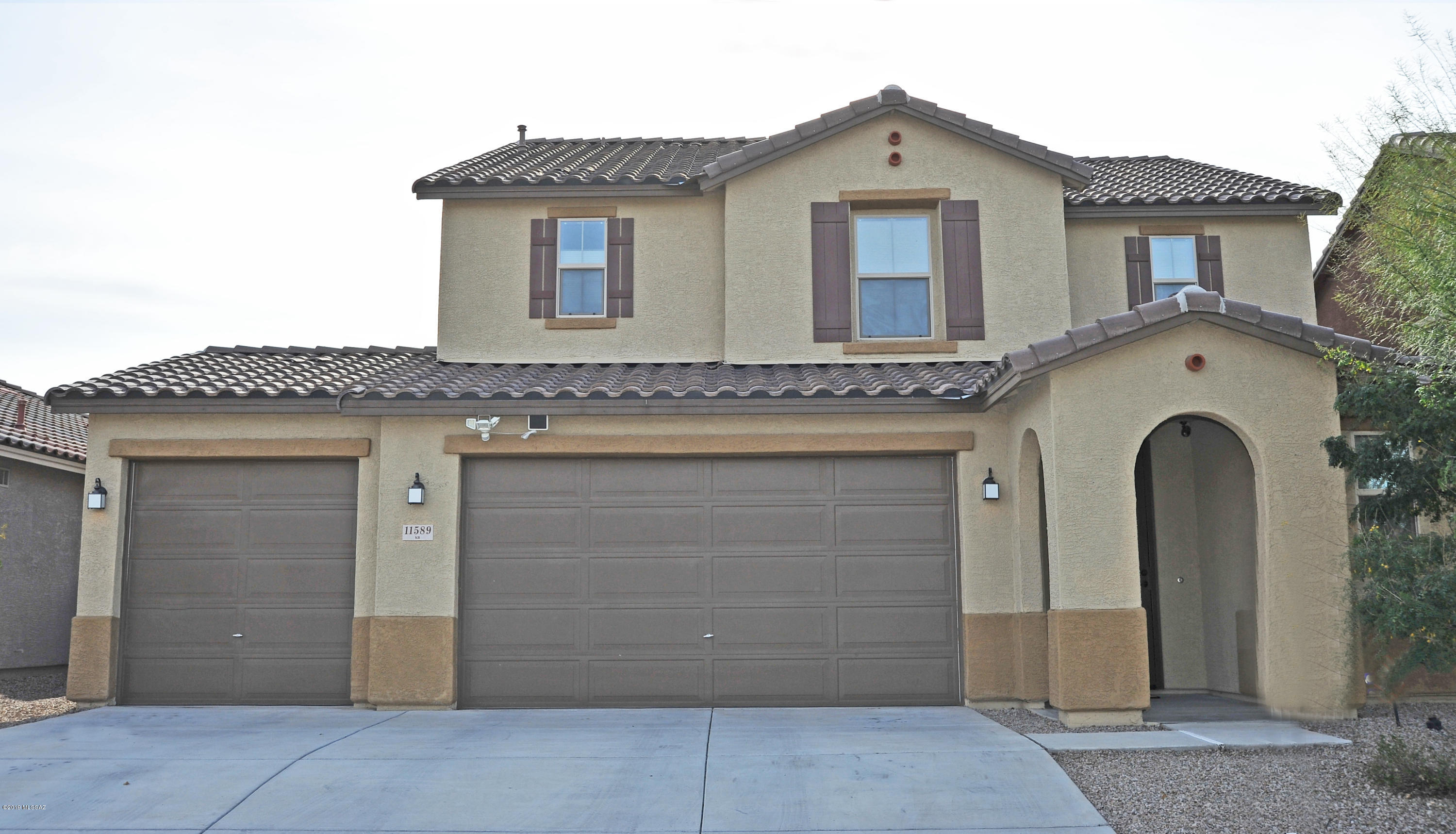 This is BETTER than new! AND comes with everything you'd ever want! Open layout, top of the line lighting, smart dual thermostats, security cameras, window coverings, ceiling fans, loft w/office space & 3car garage. Completely landscaped yard includes lush vegetation & grass plus Pebble Tec pool w/State-of-the-Art in floor cleaning! 42'' kitchen cabinets gorgeous marble counters, dec backsplash, SS appliances, 5burner gas range, huge island w/seating & wine cooler. Huge master suite w/walk-in closet. True guest quarters downstairs w/attached full bath. Custom designed bathrooms w/marble, designer sinks & cust shower surrounds. Tons of storage! This won't last-You can't get all these upgrades AND a pool-at this price w/new construction. Miles of trails, multiple ramadas, parks & Splash Park