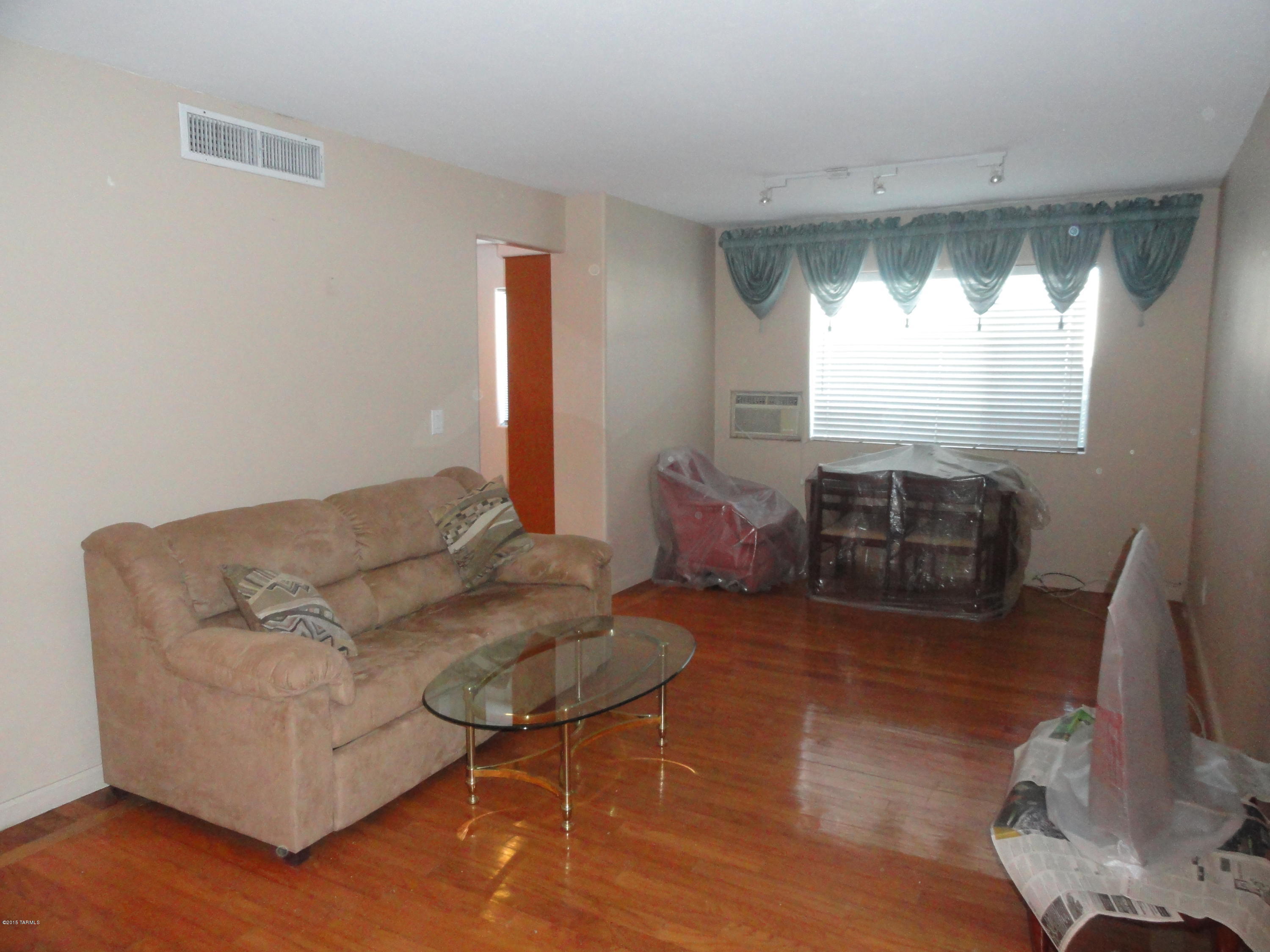 GROUND FLOOR CONDO UNIT IN IMMACULATE COOPERATIVE COMPLEX. 1 BR & Den. This unit is Totally and beautifully Designer remodeled and upgraded as follows: Designer style Real Wood flooring, Slate flooring & Countertops in Kitchen, All new custom made Real Wood Kitchen Cabinets with under cabinet lighting, Slate shower area with spa like shower setting, Custom made Master BR open closet. Superb lighting throughout. Private fenced back yard. Carefree Community  practically totally maintenance free.
Call agent for long list of items covered by HOA fee. Gorgeous Community Pool, Spa, Club House with full kitchen (reservable). You will be the proud owner of the nicest unit in the complex. Close to Shopping, Restaurants, Oak Park Mall, Medical Facilities, Bus lines, and much more. CASH ONLY!!