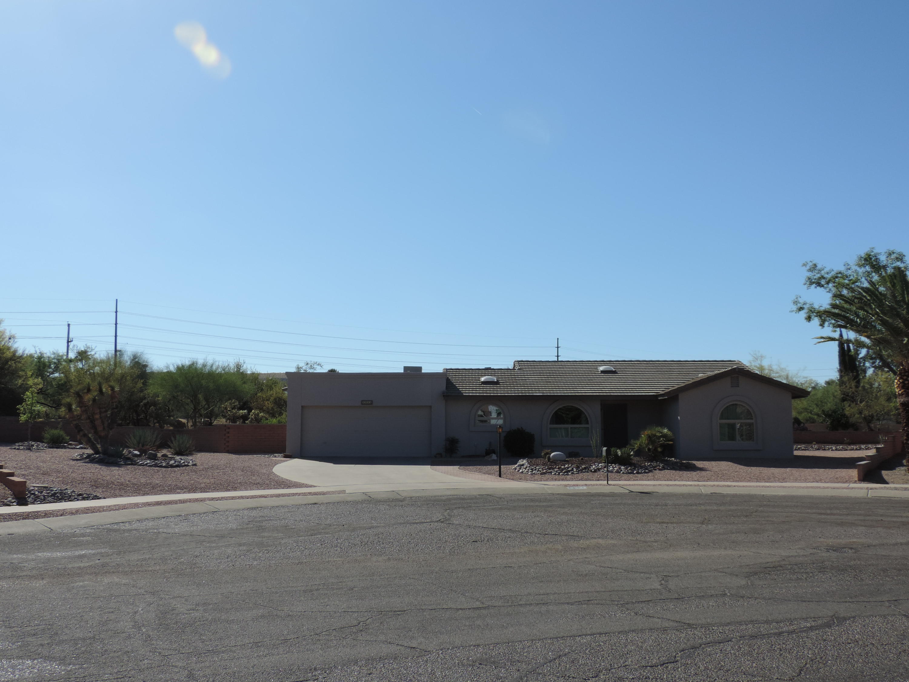 Look no further! This custom home built in 1986 has been beautifully improved by its current owners since 2012 when they purchased it. On the largest lot (.25 acres) in Country Club Vistas with low maintenance desert plants, you'll enjoy the privacy, open space and the mountain view from the front of the house. This is a house you can move into and not worry about having to improve it. New windows, complete new roof, new 14 Seer Heat Pump and duct work, new attic insulation, interior and exterior paint, window coverings and shutters, custom shelving, and more. The main living room was opened up to include what was the AZ room. It is now an office but could be used as a craft or hobby room, art studio, sun room, fitness room, etc.