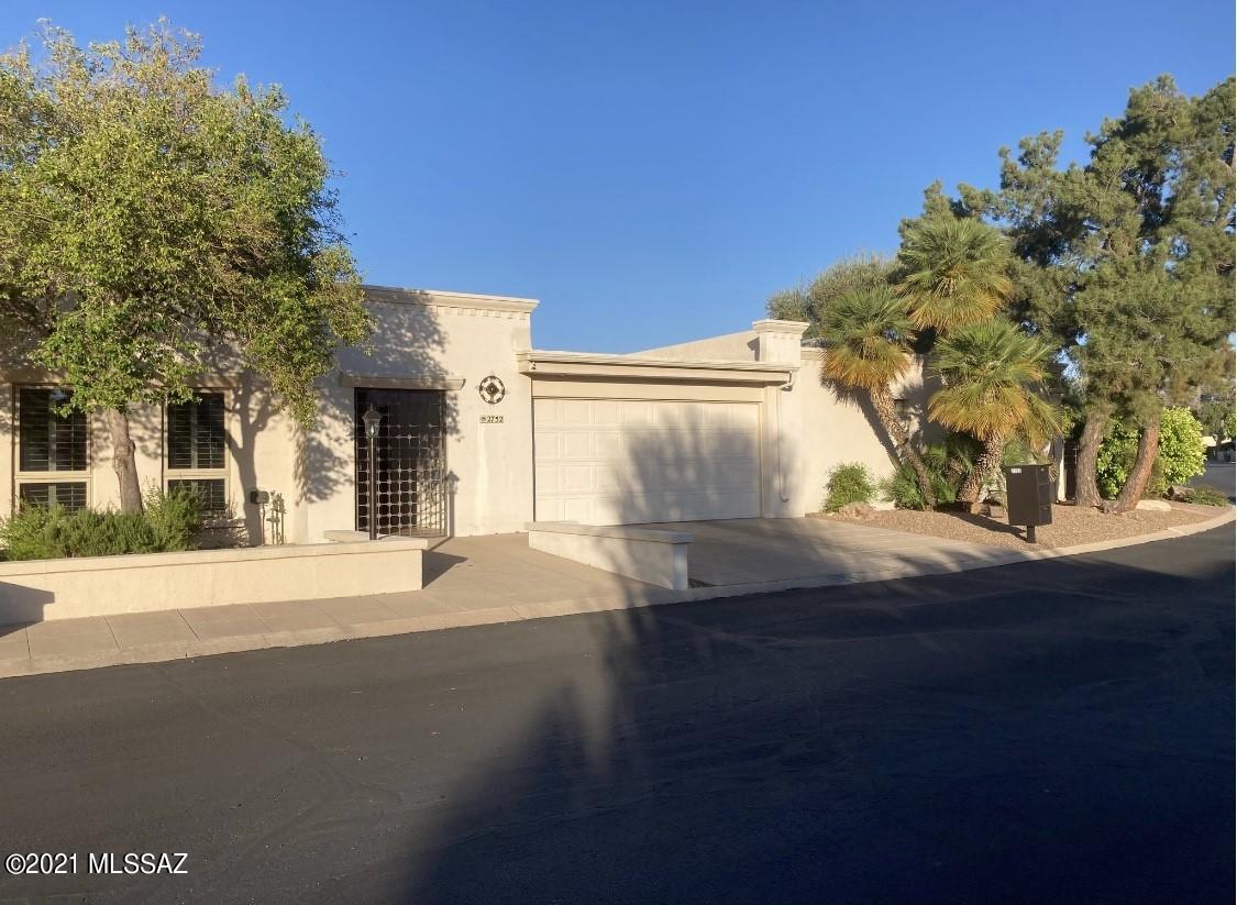 One of the Nicest properties in Casa Del Oro Norte looking over the Lush 11th Fairway of Tucson National towards the Catalina Mountains! Gorgeous townhouse completely renovated with attached separate spacious casita.  3bed/3bath, large wrap-around flagstone patios with built-in BBQ & outdoor fireplace. Main house is 2bed/2bath, updated kitchen and baths, new electrical panel 2013, replaced water main line 2013, conversion of all interior/exterior lights to LED w/20 yr life; French doors for kitchen, newer roof & ceiling over golf course side patio, newer gutters, Four zone irrigation system, new  carpet, newer water heater, interior recently painted. Plenty of storage, large rooms and lots of privacy. Located in a park-like setting of mature trees and landscaping. Year-round heated pool & spa. This active adult community.