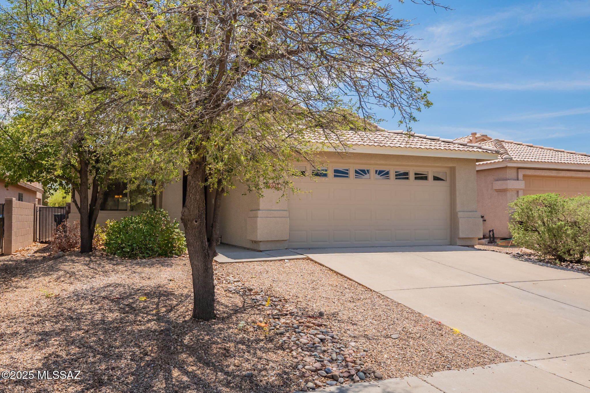 Seller will accept, or counter offers between $290,000 - $310,000. Located in the desirable Mesquite Ranch subdivision, this 3 bed/2 bath MOVE IN READY home offers many upgrades and numerous designer touches. New paint inside and out, and new high-quality carpet in the bedrooms makes this home look and feel like new. The open floor plan features a spacious great room, ceiling fans throughout, and dining area looking out to the expansive back yard nestled under the beautiful Rincon Mountains. Enjoy community amenities like the clubhouse and swimming pool, walking trails, and full basketball court. Conveniently located near shopping and dining and the I-10, this home is a perfect blend of comfort and serenity.