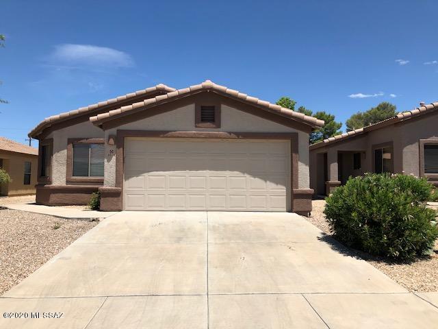 Move right in and enjoy this great family home with split bedroom floor plan in much desired East Side Location! New carpet, flooring, new a/c and furnace installed 2016, complete exterior repaint in 11/2017.  Large eat in kitchen/dining with pantry,  side by side refrigerator, gas stove, microwave, and new dishwasher. Master bedroom with walk in closet and bathroom with double marble vanity, separate shower and garden tub, main bath with shower and tub and marble counter top as well. Backyard with covered patio backs to desert berm and Rincon Mountains beyond!
