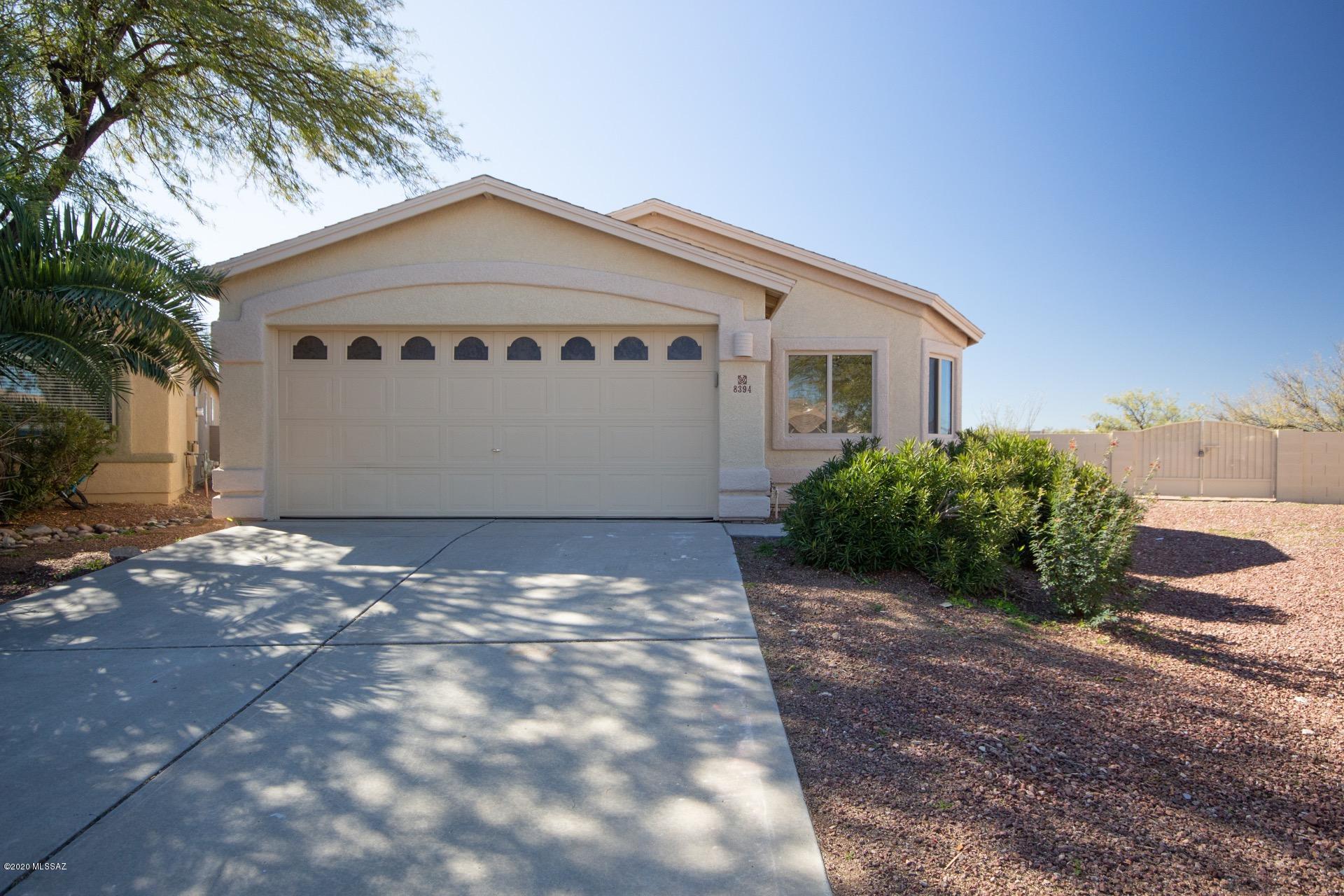 Beautiful home in highly sought after Rita Ranch. Open, bright and airy with neutral paint tones and soft natural light throughout. Spacious great room features soaring vaulted ceilings, gleaming tile flooring and plant shelving. Open concept kitchen with SS appliances and breakfast bar. Master retreat includes walk-in closet and private en-suite with dual sinks and separate tub & shower. Huge backyard offers plenty of room for pets or play, covered patio and charming fireplace with conversation area. All just a stones throw from shopping and restaurants, minutes from the I-10 and within the coveted Vail Unified School District. This one wont last. See it before its gone.