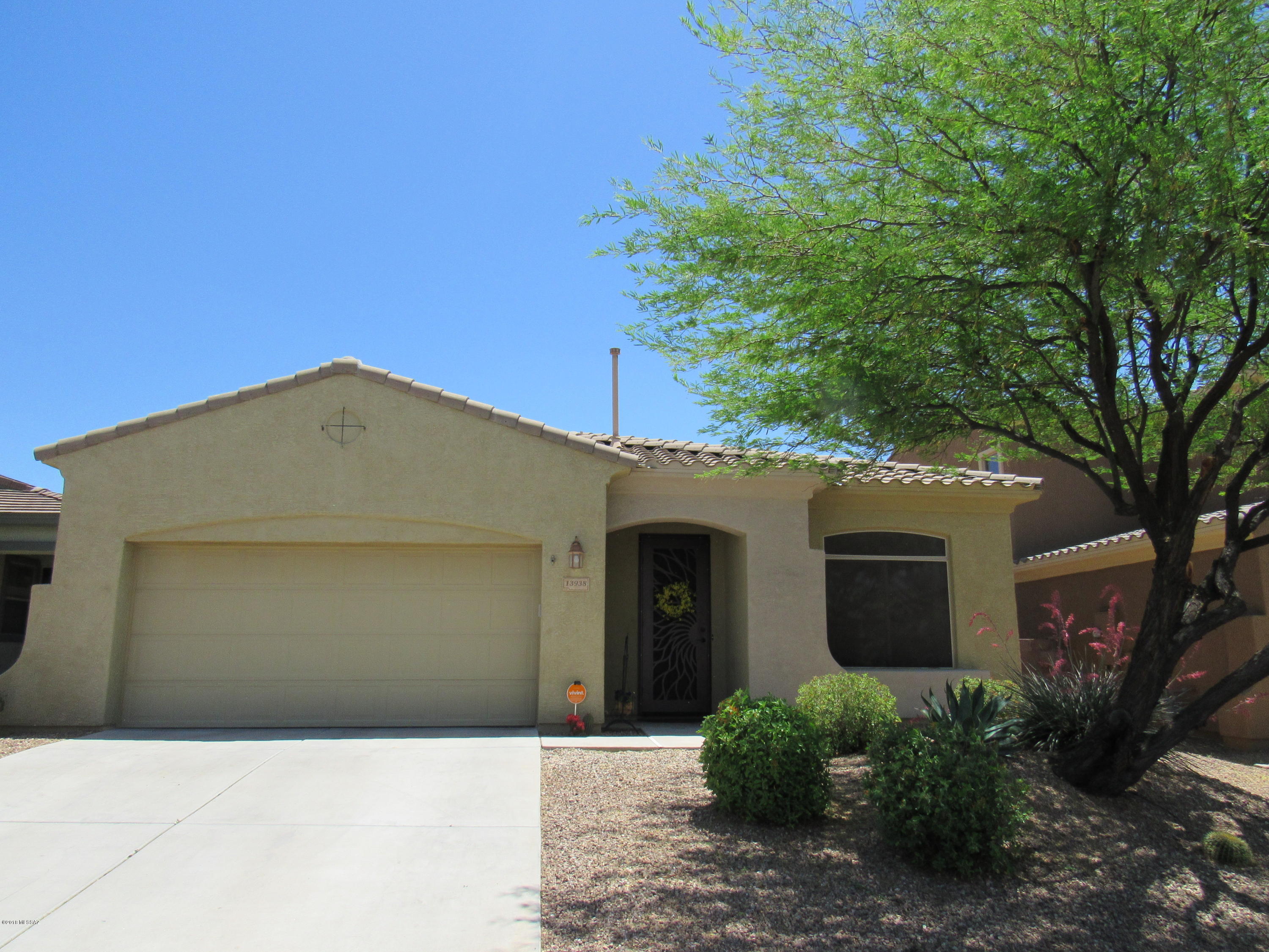 Here's a beautiful Rancho Vistoso home that's turn-key and move in ready! Open kitchen, with tons of pull out cabinets and granite tile counter tops. No carpet in the home, 10ft ceilings, lots of closet space, and surround sound speakers. Gorgeous custom iron security door. No rear neighbors for unobstructed, beautiful mountain and sunset views! Has a wifi smartphone thermostat, and newer ceiling fans and fixtures throughout. Solar heated sparkling pool for cooling off and entertaining in your backyard oasis! This is a must see home! Close to schools, shopping, movies, and hiking at Catalina State Park. The pool loungers, chiminea, table, chairs and umbrella will stay. Garage has storage shelves/cabinets, overhead storage, and epoxy flooring. Don't miss this opportunity to live in paradise
