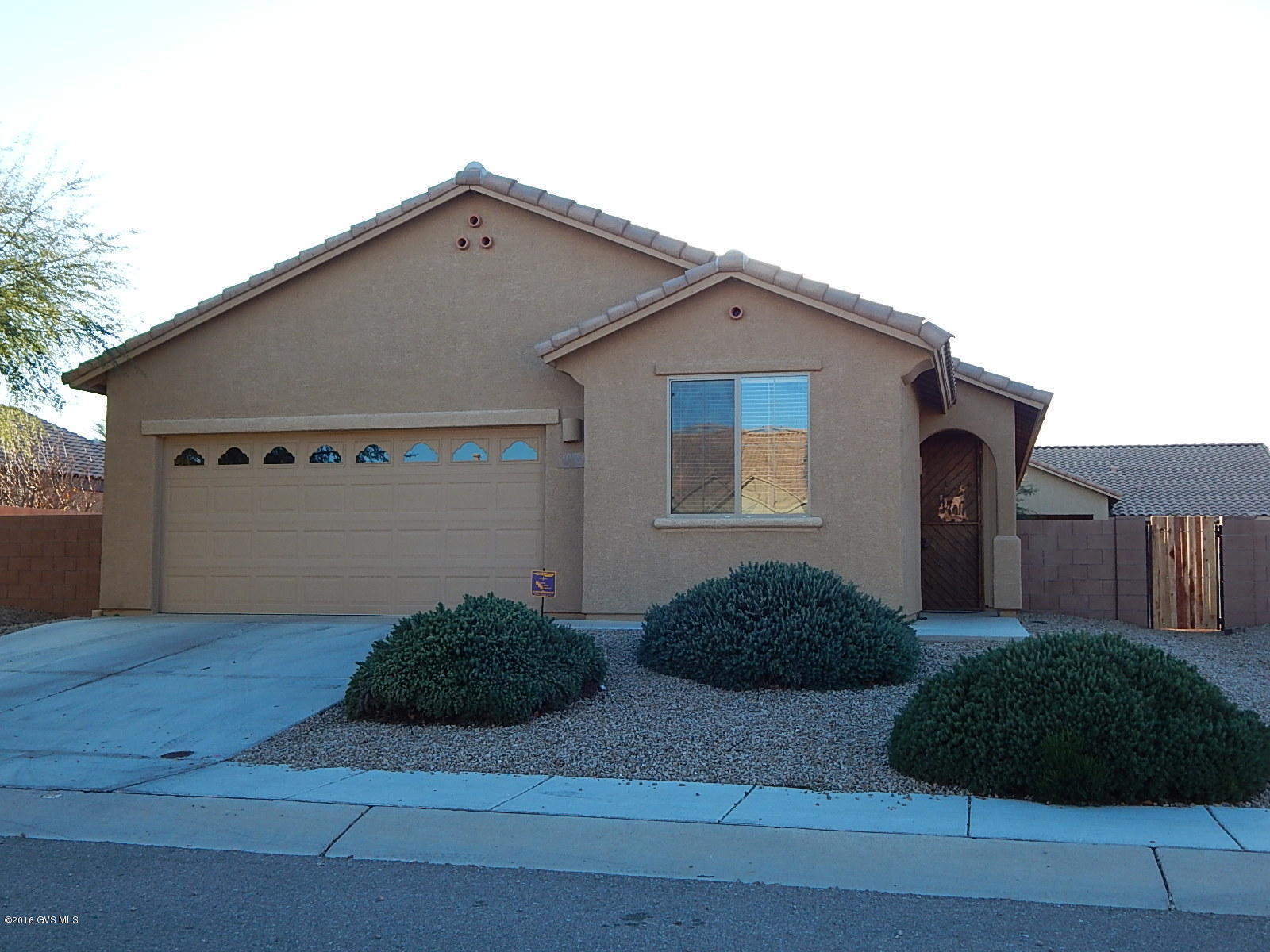 Fresh and clean, ready for a quick move. One story 4 bedroom/2 bathroom home with semi-open plan, featuring granite counters, stainless appliances and upgraded cabinets in the kitchen, good sized fully fenced wrap around yard, and a 2 car garage located in the Madera Higlands pecan orchard neighborhood. Amenities include a nice park, pool, tennis and basketball courts. Easy commute to Nogales or Tucson.
