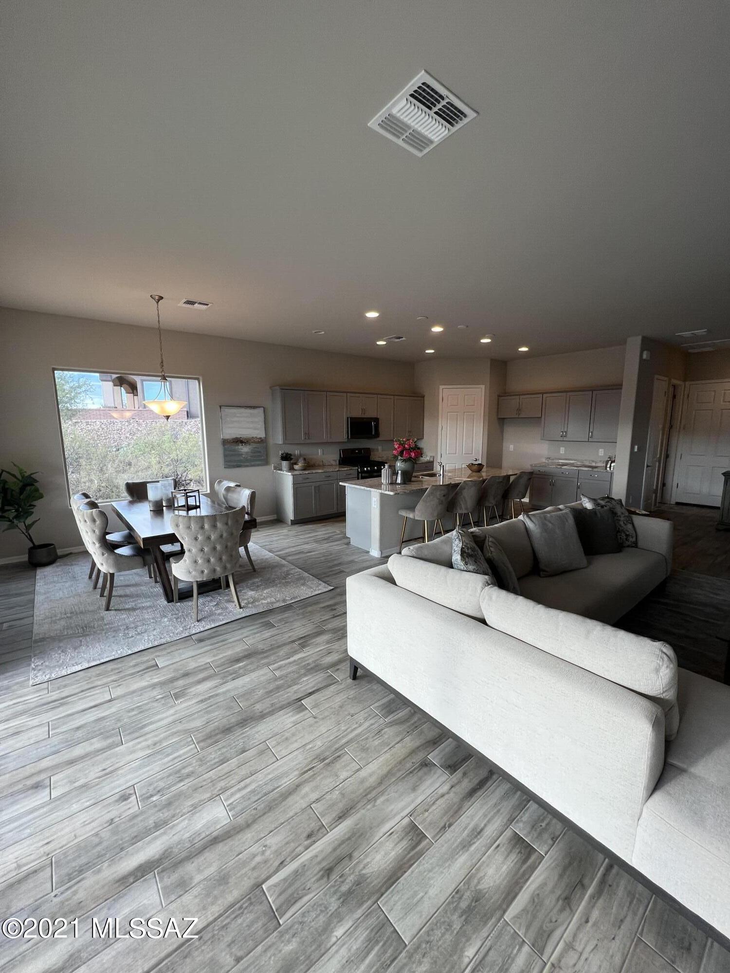This modern Rosewood model has knock out views of the Santa Rita mountains and is set on a large lot in the desirable Canoa Ranch community.  Large lot provides privacy, peace, and quiet. 3 car garage, 48'' fireplace in Great Room, extensions in Master bedroom and bedroom2, beautiful master bath with a huge walk in closet.  Call today to have a tour of this gorgeous home.