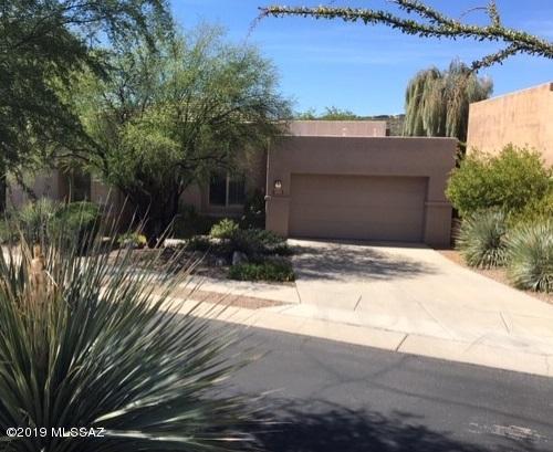 Tons of privacy, open to HOA common area in back and to one side. Completely remodeled from top to bottom. Everything new...flooring, paint, kitchen, baths, interior doors, hardware and almost all new windows (Anderson with lifetime warranty).   Contemporary home with great room, high ceilings, split bedroom plan, large walk-in closets, plenty of storage, no steps. Located in the Foothills in sought after Gated Bonita Ridge. District 16 schools. Community pool and spa. Immaculate!