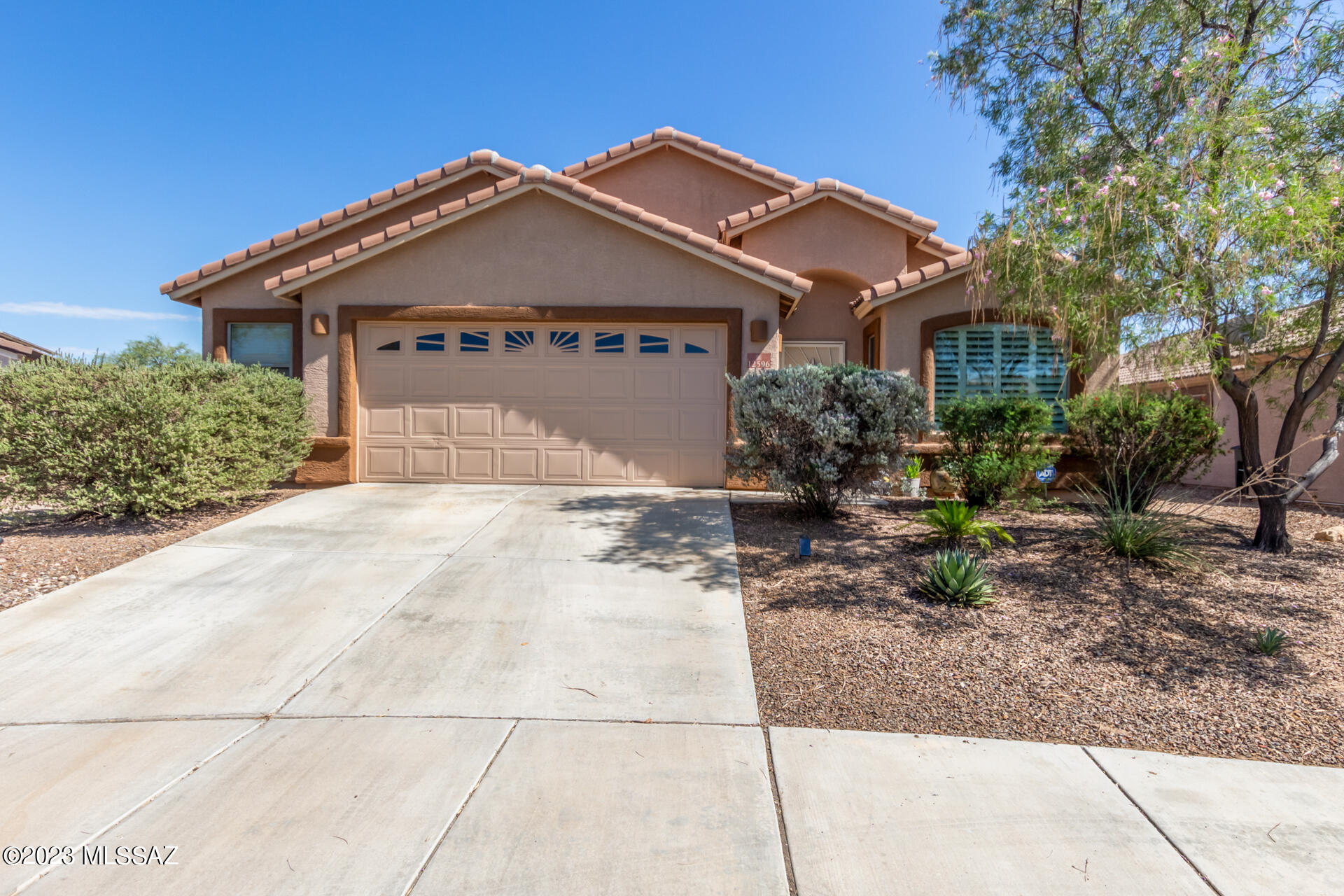 Nestled within the prestigious Gladden Farms community, this property epitomizes modern luxury and sustainable living. Situated on a premium lot, it ensures privacy with no rear neighbors, providing an atmosphere of tranquility. Step outside to your private oasis, complete with a refreshing pool, shaded ramada, and a lush, real grass lawn, creating a haven for relaxation and entertaining. Embrace a greener future with a leased Tesla solar system saving on energy bills. Inside, the vaulted ceilings and open floor plan create a spacious and inviting environment, and the modern kitchen, equipped with high-end appliances and a central island, makes daily living a pleasure. This Gladden Farms gem offers the ultimate in luxurious, sustainable living—don't miss your chance to call it home.