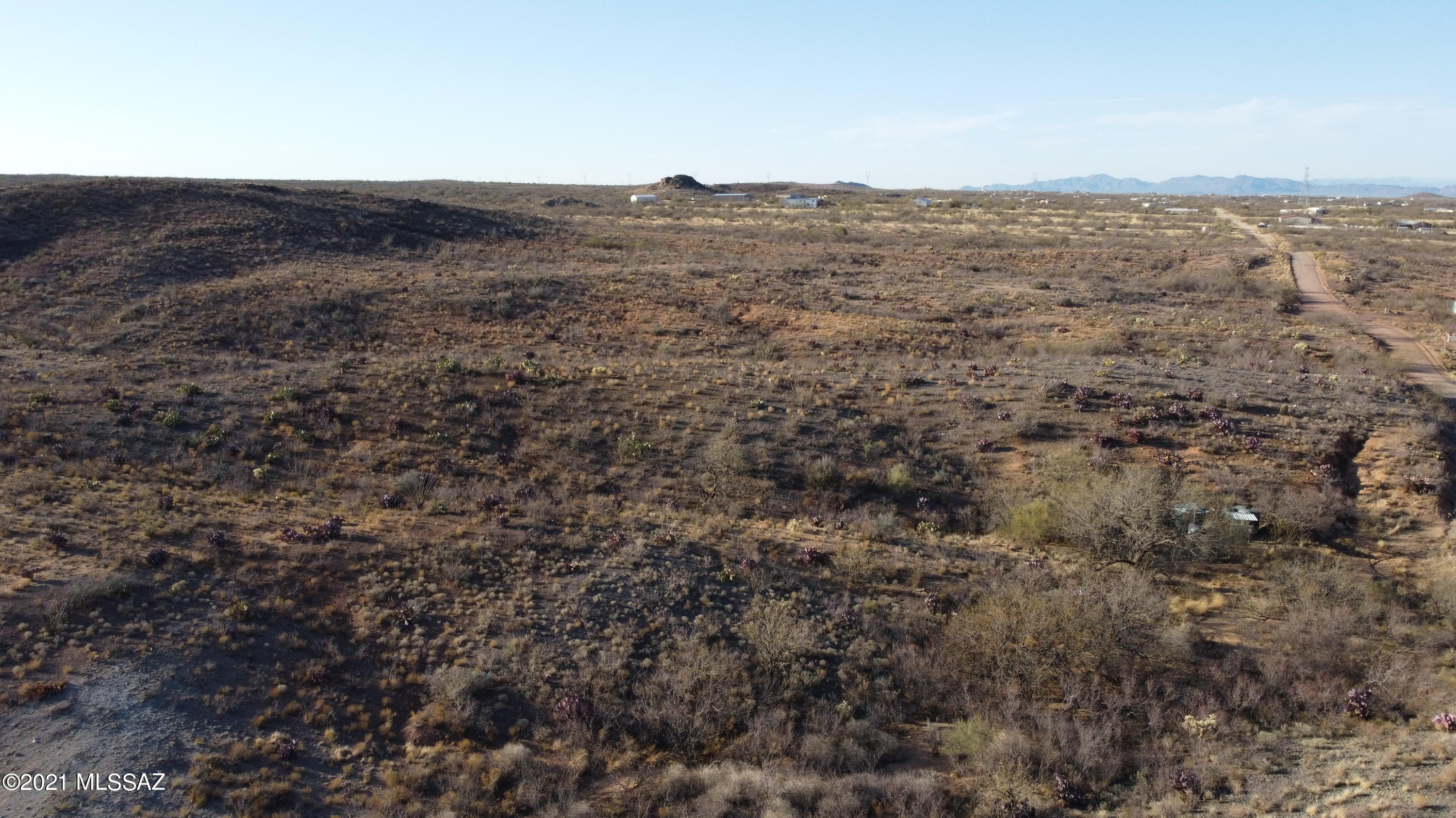 Undeveloped large propert.  Access to electricity and Shared well on property.  Home build must be minimum of 1500 sq ft and site built.  HOA maintained road.  Great Views and Privacy.