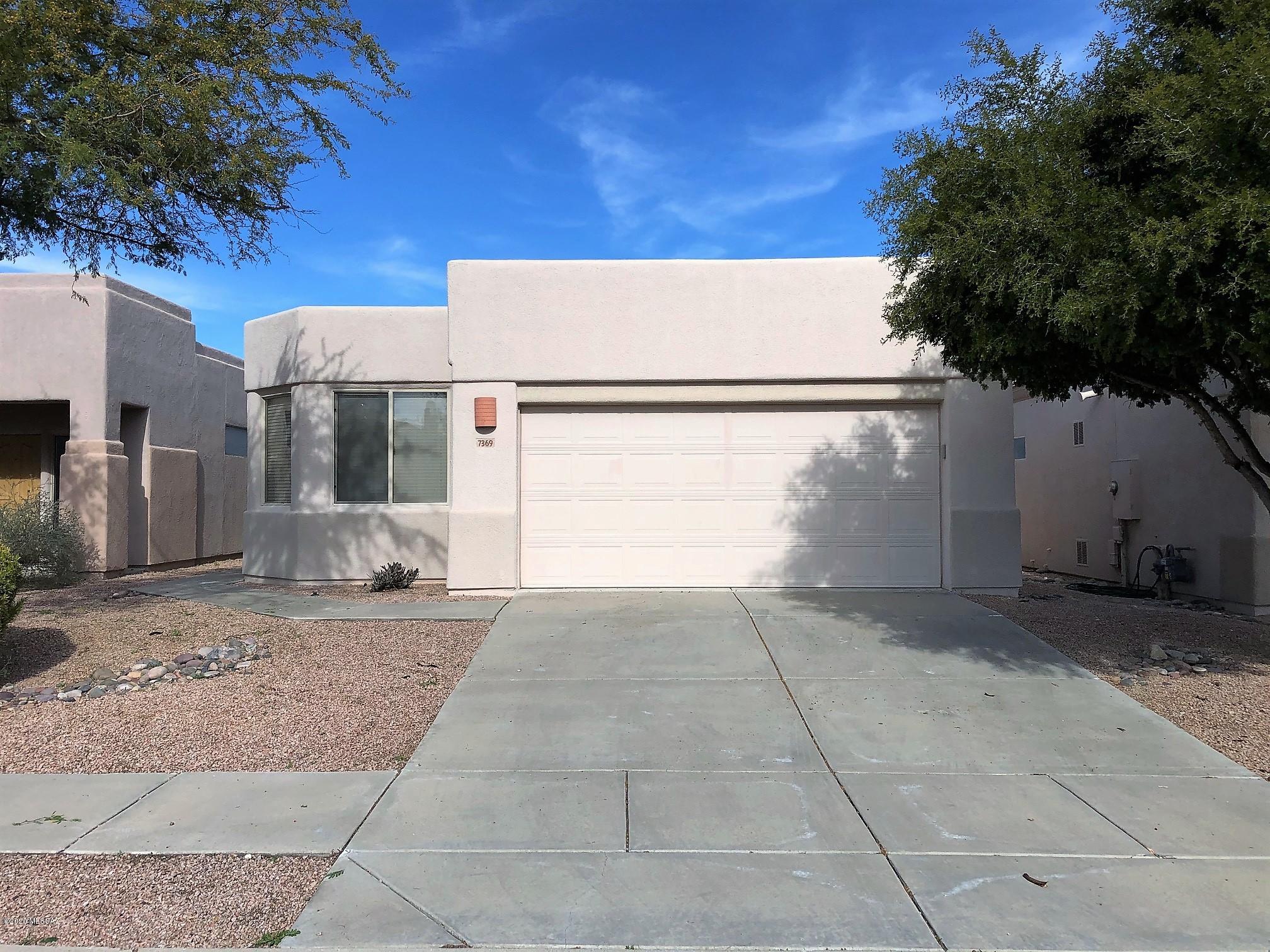 GATED ACCESS!! Bright and Open Great Room Plan by AF Sterling! Spacious Kitchen featuring Granite Countertops, breakfast bar and plenty of cabinet space opens into your great room.  Tile in the traffic areas, carpet in the bedrooms. Two car garage includes a utility sink. Low care backyard with landscape and hardscape. Close to a community pool. No pets, please.