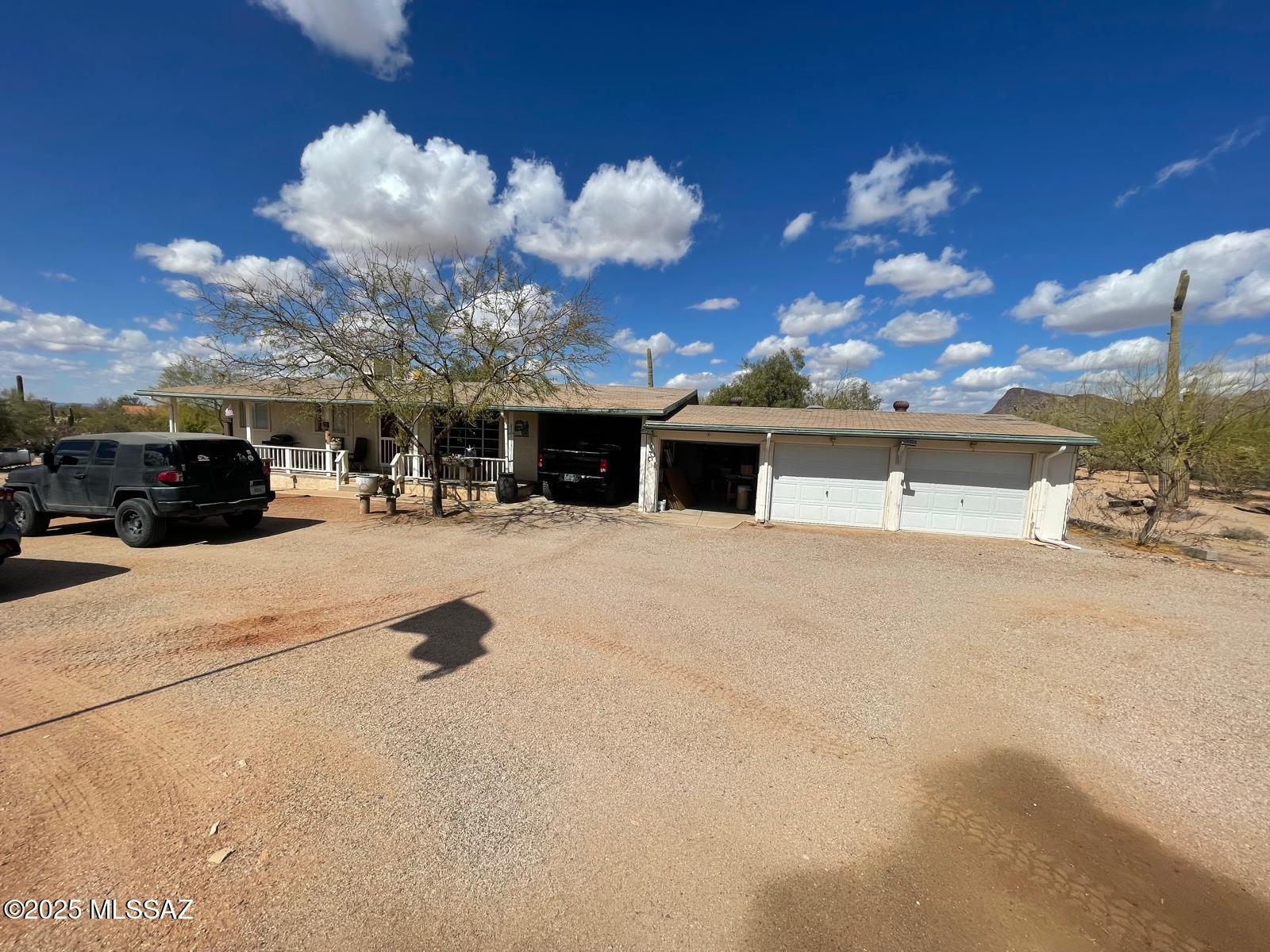 Charming home with 3-car garage. Updated kitchen & baths. Hardwood floors, tile kitchen. 1 bed used as office. AC split unit, fireplace. Laundry needs flooring. Older roof, no foundation issues. Floodplain area. Fridge, stove, washer/dryer not included.