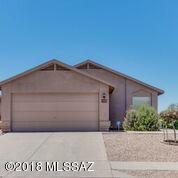 This home is in a very popular east side neighborhood and shows like a MODEL. It sits on an elevated corner lot for privacy and mountain views. Featuring an open concept and split bedroom floor plan, engineered wood flooring and tile throughout, no carpet, tasteful and soothing interior colors, newer fixtures, ceiling fans and stainless appliances, cherry colored cabinets, well liked granite counter tops with pass through breakfast bar. The 3rd room could be a bedrooms (with Armoire), den, library or study with popular slider barn doors. Epoxy garage flooring with extra garage storage and water softener. A truly meticulous home, move in ready.