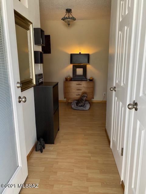 Reduced price! Beautiful Central Tucson upstairs 2 bed/1 bath Coop! Large living room with additional patio enclosed. Kitchen has updated cabinets, counterspace and storage. Laminate wood floors and decorative colors make this unit really nice! Monthly fee includes: Water, sewer, trash, property taxes, exterior, roof, pest, grounds, pool and more. Cash only, no rentals.