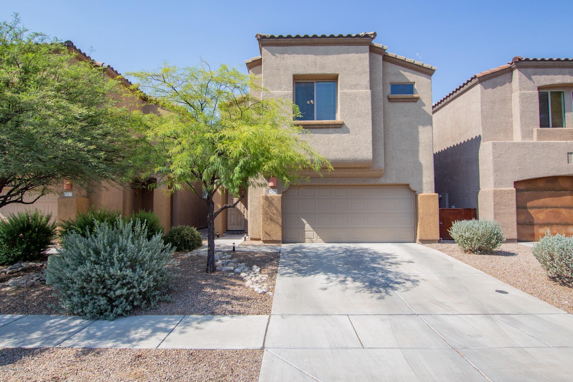 Gorgeous Home in the desirable Community of Riverside Crossing.  Step into perfection & this ''Model'' perfect home! Handsome wood ''look'' tiled floors, soothing palette, window blinds, ceiling fans, & patio access from kitchen. Center kitchen island, granite counters, breakfast bar, SS appliances, glass tiled backsplash, & plethora of wood cabinetry with crown moulding. This home is a pleasure to show with custom palette in all bedrooms, plush carpet, ample closets, & 2.5 pristine baths. The loft has endless possibilities.  Pavered backyard covered patio & canvas covered patio for  dining. Convenient location to U of A, Shopping, & more.