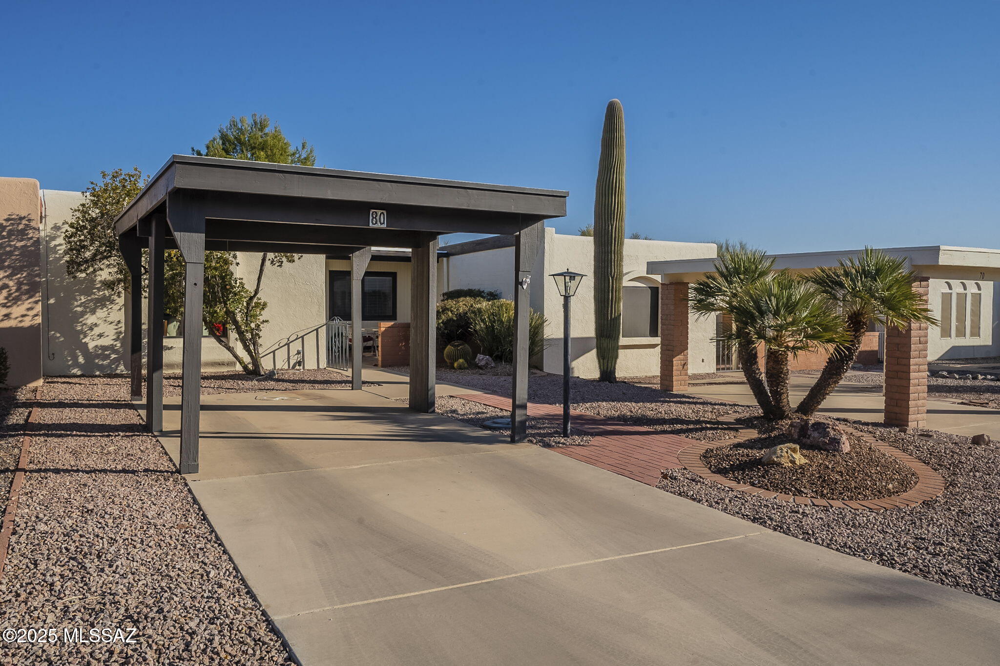 MOVE-IN READY & SOLD FURNISHED!
This updated 2BR/2BA townhome is perfectly situated on a quiet street, backing to a peaceful desert wash for ultimate privacy. Enjoy a charming front courtyard and a shaded back patio, ideal for relaxing or entertaining.

Inside, you'll find new flooring, updated windows and doors, and refreshed bathroom cabinets. A built-in Murphy bed provides flexible space, making it perfect for visiting guests or home projects. Home is being sold fully furnished, making it truly move-in ready!

Convenient covered parking is just steps from your door, and you're a short walk to the heated neighborhood pool. Close to shopping, dining, the library, and recreation.

Possession available after April 1st.

Don't miss this turnkey home in a fantastic +55 community!