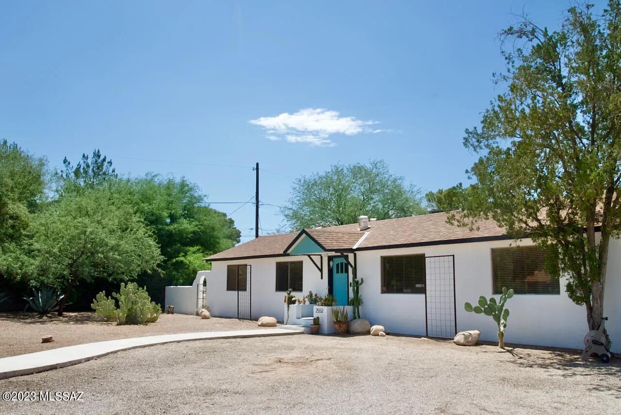 This 1400 sqft, 2 bedroom, 1 bathroom charming home is nestled between La Madera and Winterhaven in central Tucson. As you enter the home, you are greeted by a spacious living area with an abundance of natural light and beautiful real wood flooring throughout. The living area with wood burning fireplace flows seamlessly into the dining area. The primary bedroom features french doors to a private, secluded patio already set up with electricity for a hot tub. The home even features a very uncommon for AZ cellar/basement. The massive ⅓ acre lot has plenty of room for RV parking, space to build a guest house and anything else you can dream up.
