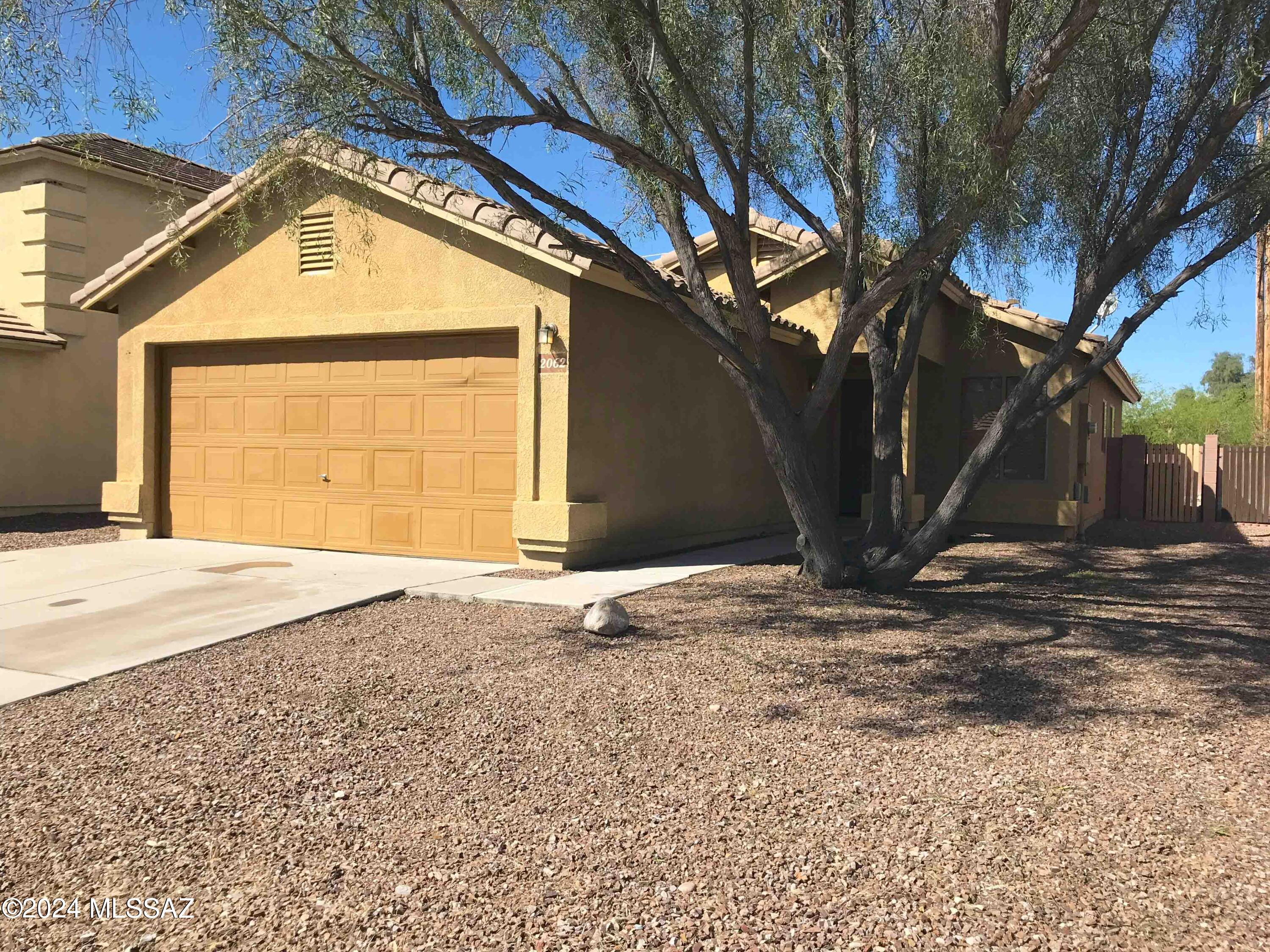 This cheerful & bright contemporary home features 3br/2ba, 2 living rooms,  laundry room & a 2-car garage. Kitchen with Dishwasher, new SS Range & new SS fridge that opens into Dining Room that leads to the 2nd Living Room & access to covered patio w/  block fenced backyard. Freshly painted interior & New Carpet. Perfectly situated for quick & easy access to The LOOP (network of shared-use paths). Located on a Cul-de-sac. N/S orientation. Convenient to Downtown Tucson, Freeway, UofA, Pima College & Silverbell Golf Course. Renter's insurance required. Non smoking home.