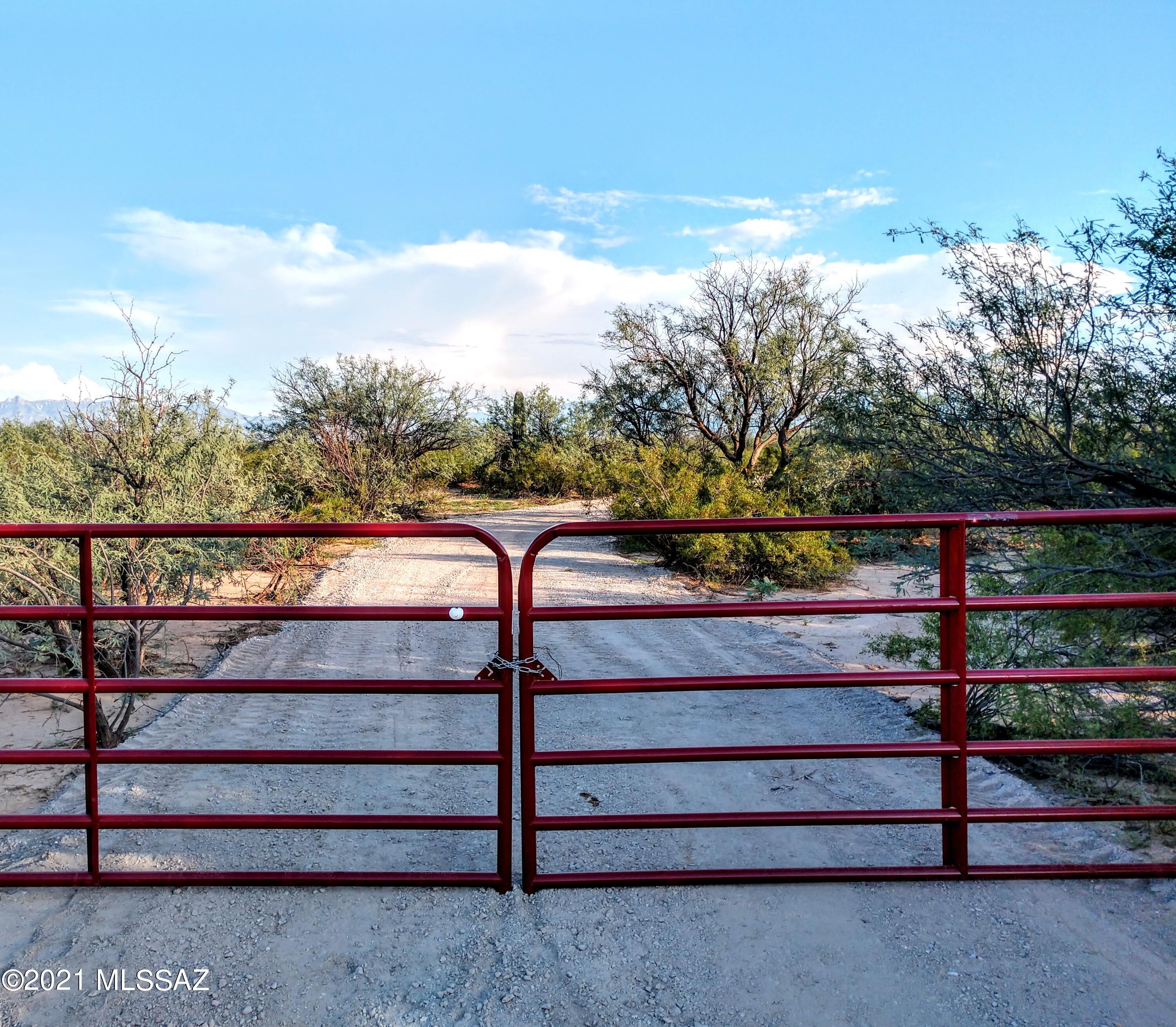 RARE 5.25 Acre property with Utilities and Well ready for your dream home! Convenient 7 minutes to Sahuarita town center, restaurants, supermarkets and Northwest Hospital. Amazing 360 degree views including Mt. Lemmon and Madera Canyon from the home build site. Transformer at property for easy electrical hookup. 2 well share with excellent 30 GPM output, brand new high quality pump and pressure tank installed. Quality compacted driveway with anchored entrance swing gate. Bring the pets, horses, live stock; plant lush gardens or just enjoy your walking paths over this expansive property. Easy access to both I-19 and I-10 in minutes - truly the best of both privacy and convenience.