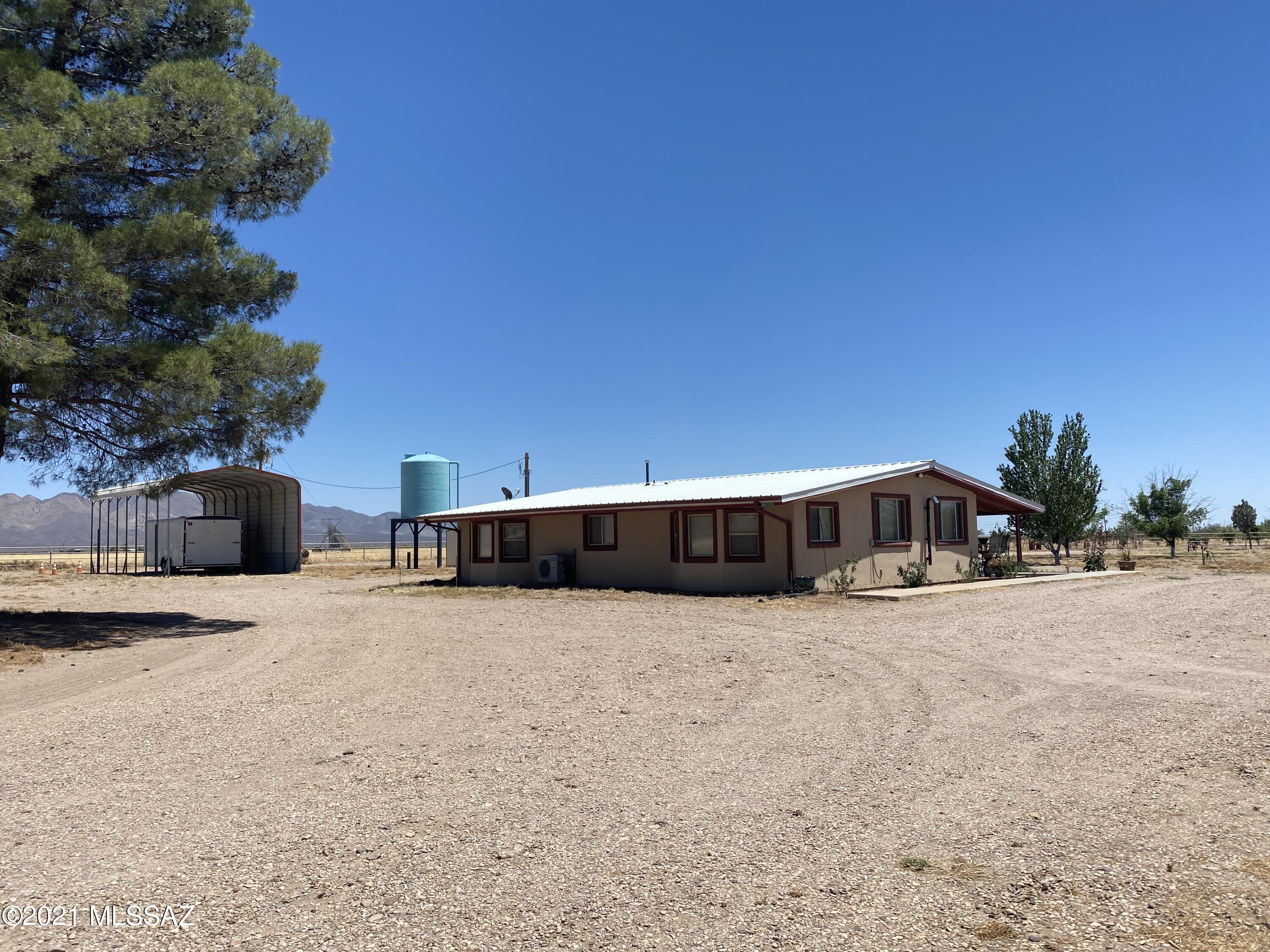 This countryside EQUESTRIAN ESTATE was once the home of 2 dozen horses & it's calling for horses again! Beautifully remodeled ranch house sits on 35 acres of ORCHARD & pasture. 245 fruit & nut trees comprise the 6 acre orchard. 147 nut trees of INCOME PRODUCING pecan, pistachio & walnut. 98 fruit trees of cherry, peach, apple, apricot, plum & nectarine. 100 GPM IRRIGATION WELL supplies the drip irrigation system. 720 sq' covered RV parking has full hook-ups & dedicated septic system. Home office could be used as 3rd bedroom. WELDED STEEL PIPE horse facilities, 8 acres of IRRIGATION RIGHTS, 900 sq' insulated shop with 220V, 1250 sq' greenhouse, 1200 sq' hay barn, 2,000 gal water tank, 3 storage containers & 3-phase power available - THIS RANCH HAS IT ALL!!