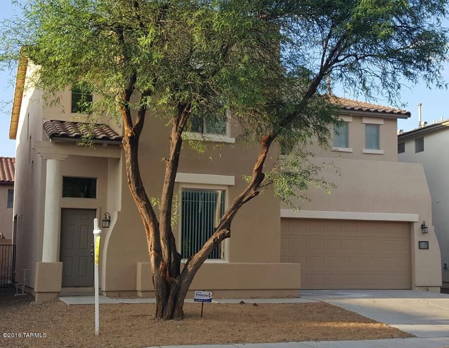 Popular spacious 2,221 sqft floorplan with soaring ceilings which is ready to move-in located in the popular community of Rancho Sahuarita. Fresh two-tone paint inside. New Carpet & Tile. New cabinets with granite countertops in Kitchen and Bathrooms. Kitchen is open and bright.