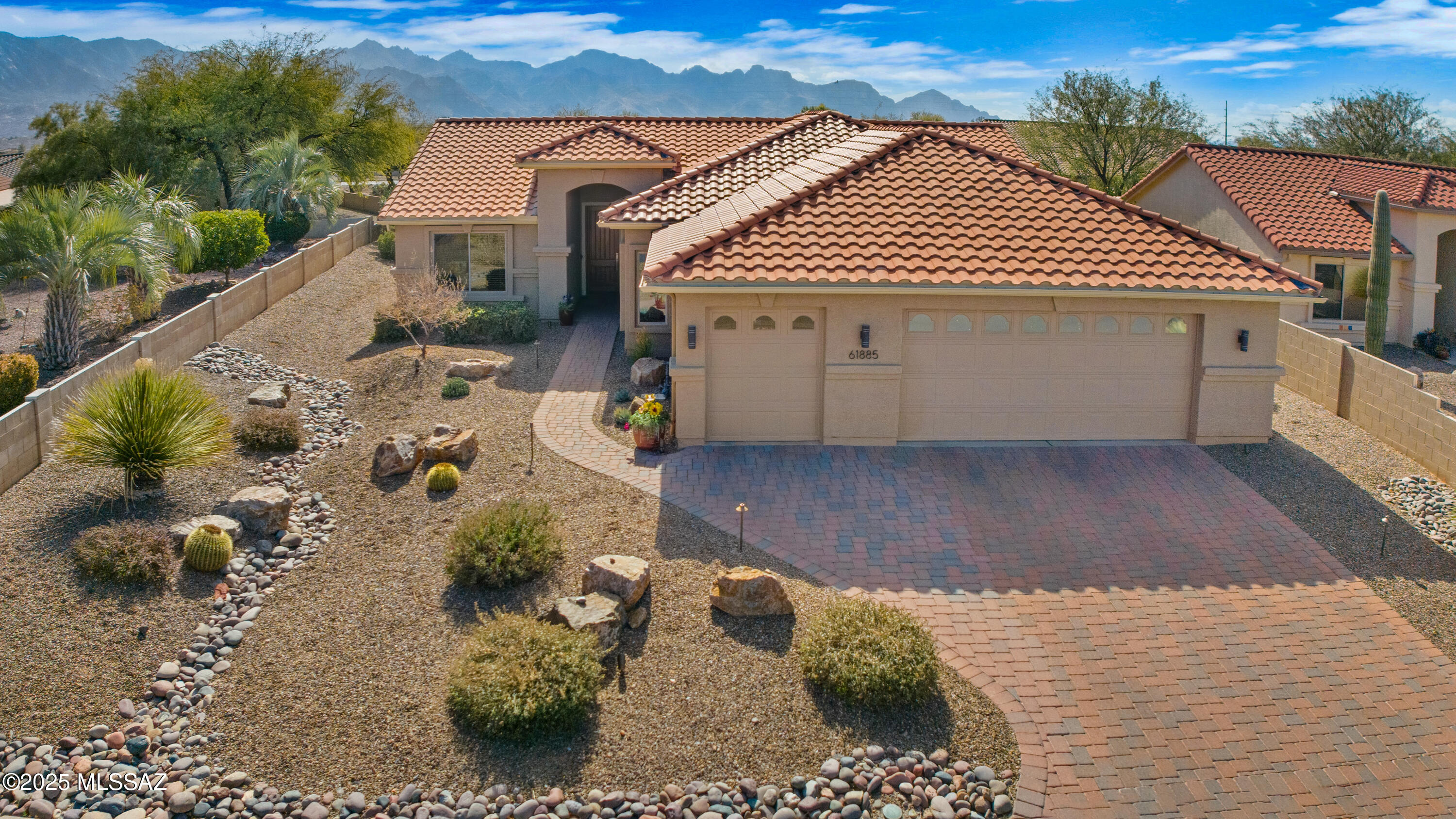 Beautifully updated and expanded Laredo with owned solar is the perfect desert home. Great room plan features engineered wood floors and a custom entertainment center. Stylishly updated kitchen with Cambria Quartz countertops, full-height tile backsplash, enlarged island with storage and black stainless appliances. Additional cabinet & counter with a 4 Ft extension to the eating area. The den offers engineered wood floor, a built-in office and a queen wall bed with recessed lighting. The spacious owner's suite has a bay window, updated tiled shower with glass block and a walk-in closet organized by ''Closet Trends''. Outdoor living is enhanced by the south facing backyard with mountain views backing to open space. Relax in the hot tub after your day of SaddleBrooke activities. Special features include:
Money Saved on your electric bills with the owned 6.7 kWh SunPower solar with 27 panels. Average $24.95/month.
Golf cart deep enough to park two golf carts or can be a spacious work shop.
Garage is extended by 6 feet, epoxy floor coating & full wall cabinet storage.
Solar ventilation fan in the attic with exhaust wall fan to the garage.
Water softener.
Laundry room has a utility closet and space for a freezer/frig.
4 inch baseboard moldings throughout.
2 Ft extension to the East side of the house enlarging the den, hall bath and guest bedroom.
8 Ft solid wood Jeldwen entry door.
Full length covered patio with stucco finish columns and beam.
Covered patio with concrete overlay texture and expanded paver patio area.
Front pavers for driveway and walkway.
Front landscape lighting.
Irrigation system replaced with 3 zones (PVC piping).
Whole house gutter system.