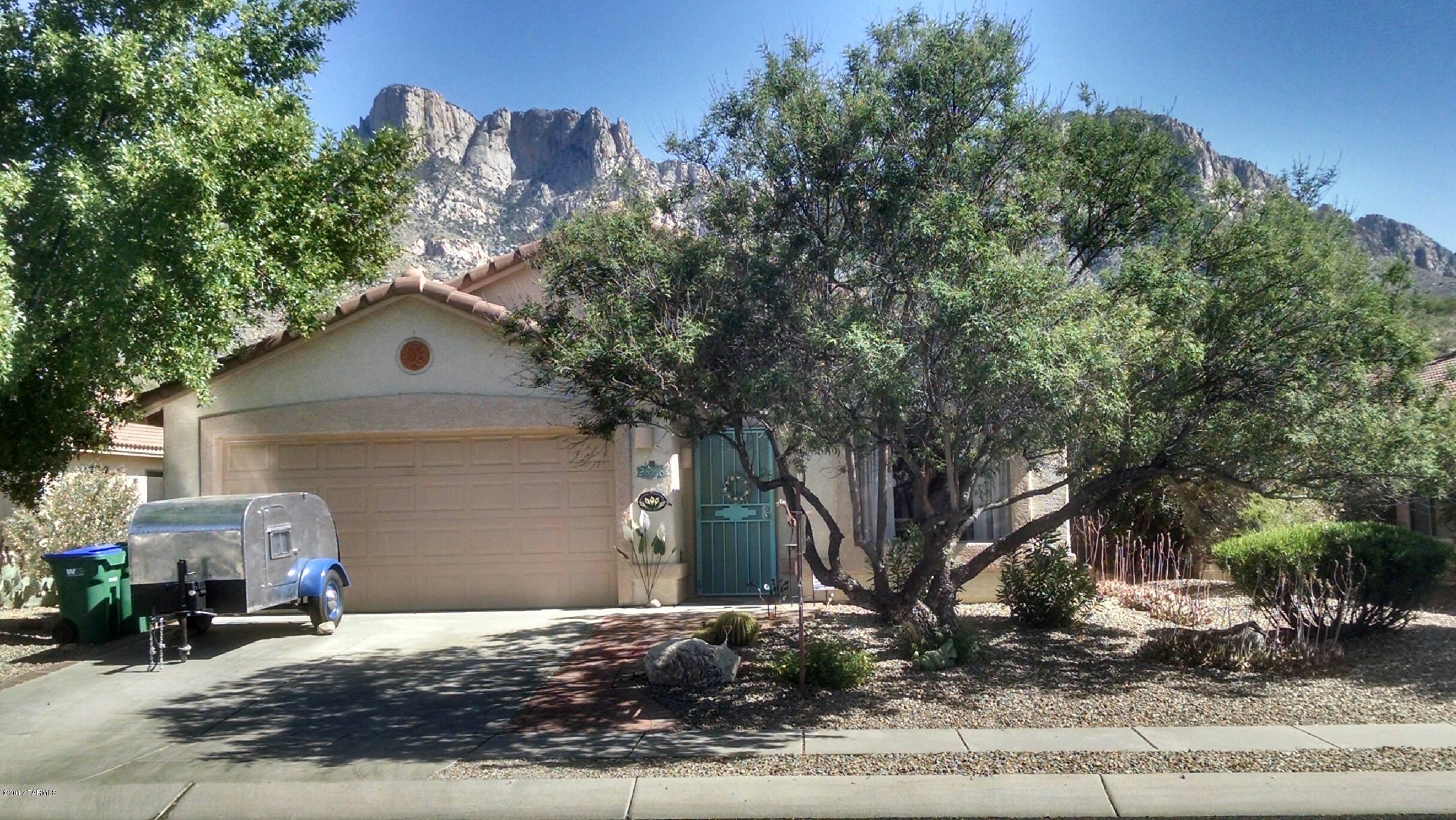 The surroundings of this home will make you want to stay and relax.  Kick back on the covered patio, dip your toes in the pebble tec pool or lounge in the spa while enjoying the outstanding views of the Catalinas and the amazing night skies. The backyard also has mature fruit trees and roses.  Great indoor space with 4 bedrooms, 2 baths, family room with fireplace for our 'chilly' winter mornings.  The kitchen includes newer granite countertops, back splash and kitchen appliances.  Easy access to cycling routes, hiking trails from the neighborhood to Catalina State Park. You feel secluded in this great neighborhood, but you are just minutes away shopping, restaurants, health care, and nearby the Saturday morning outdoor marketplace for fresh Arizona grown vegetables.