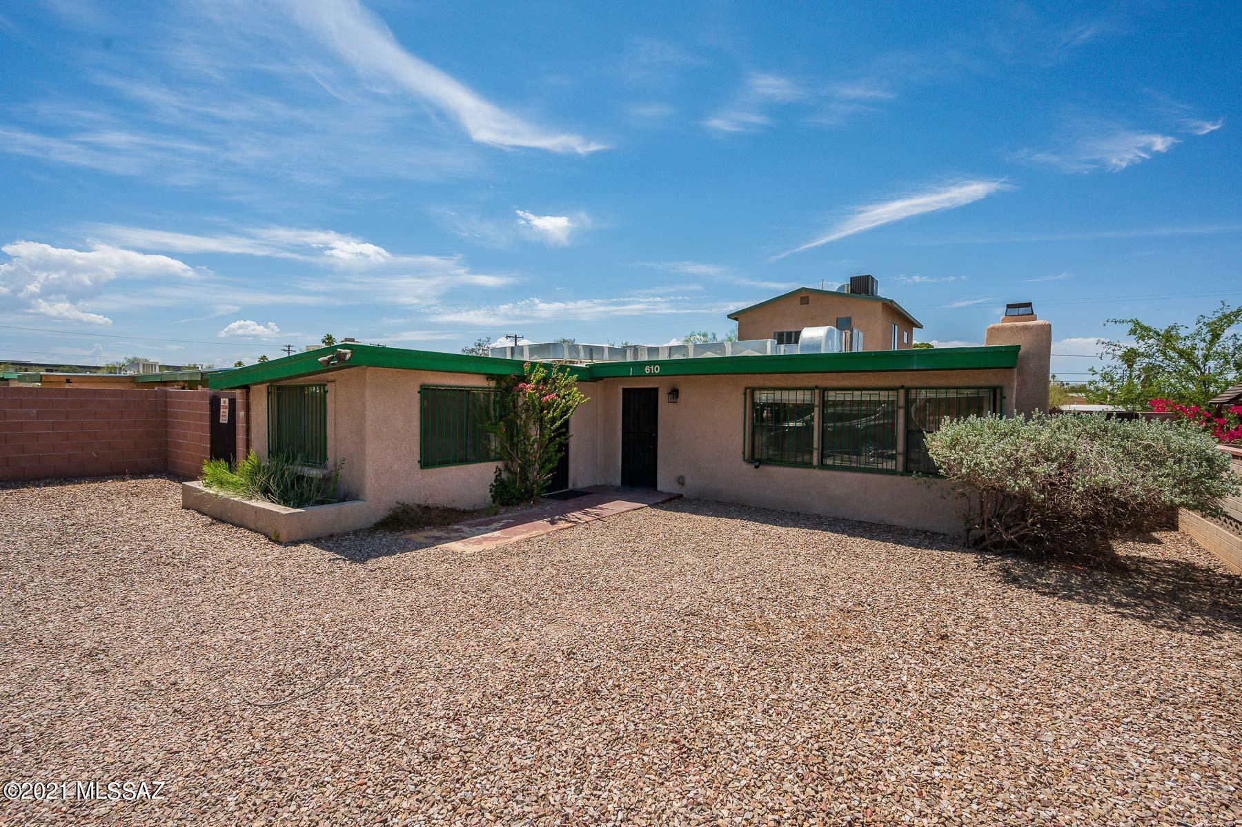 Two detached houses on one lot. Front house is 4 bedrooms, 2 bathrooms with private backyard with artificial grass and brick pavers, private parking, inside laundry, fireplace, ceiling fans, and upgraded ceramic tile throughout, built in 1946. The back house is 5 bedrooms, 3 bathrooms and was built in 2004. It has two private yard spaces, private parking, fireplace, big kitchen, tile in living and wet areas, carpet in bedrooms and stairway. Perfect for owner occupant or investor.