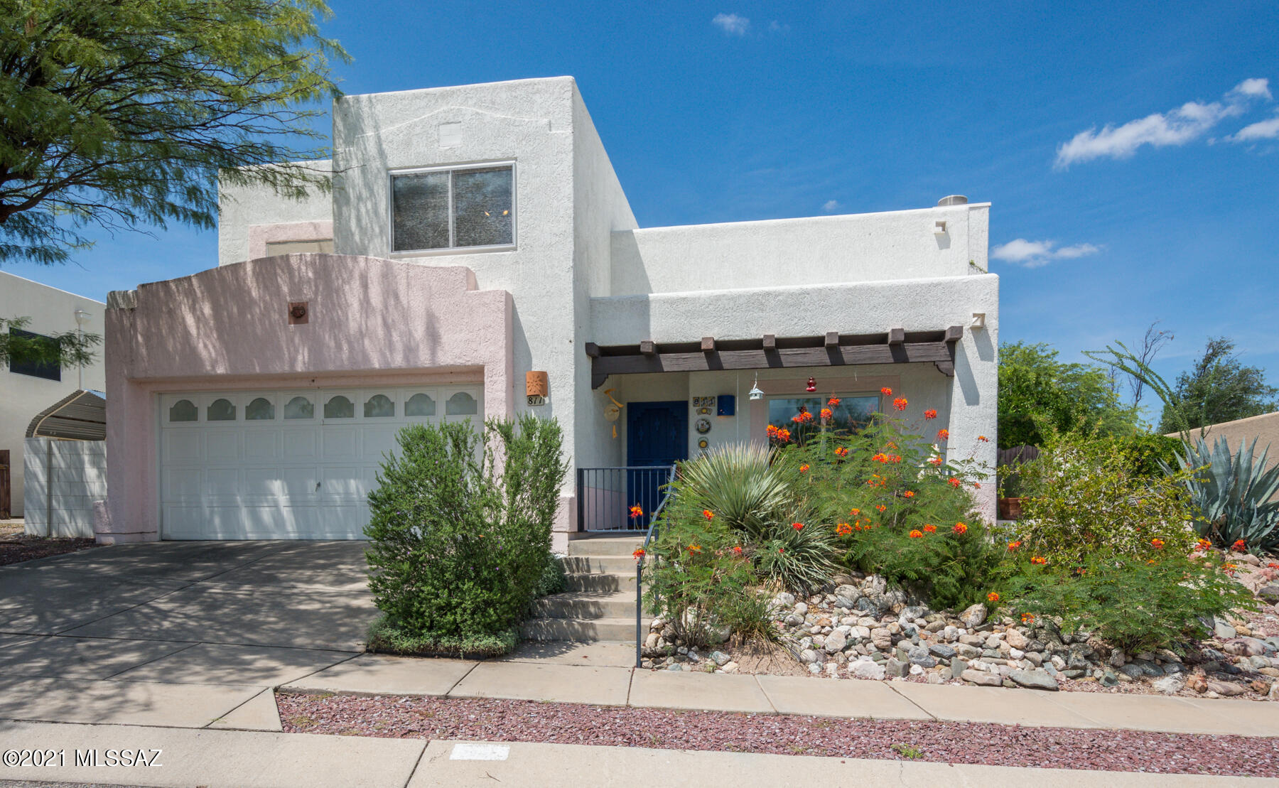 Enjoy the Sunrise with your morning coffee on the front porch with the majestic Rincon and Catalina mountain ranges in the back ground.  HOA owns all the land across the street so the views are protected.  Soaring ceiling, clearstory windows.  Bright, open and spacious.  Majority of windows replaced with double and triple pane windows.  Balcony off Master looks out into the park-like backyard.  All Appliances Included!!  Don't miss this opportunity!!