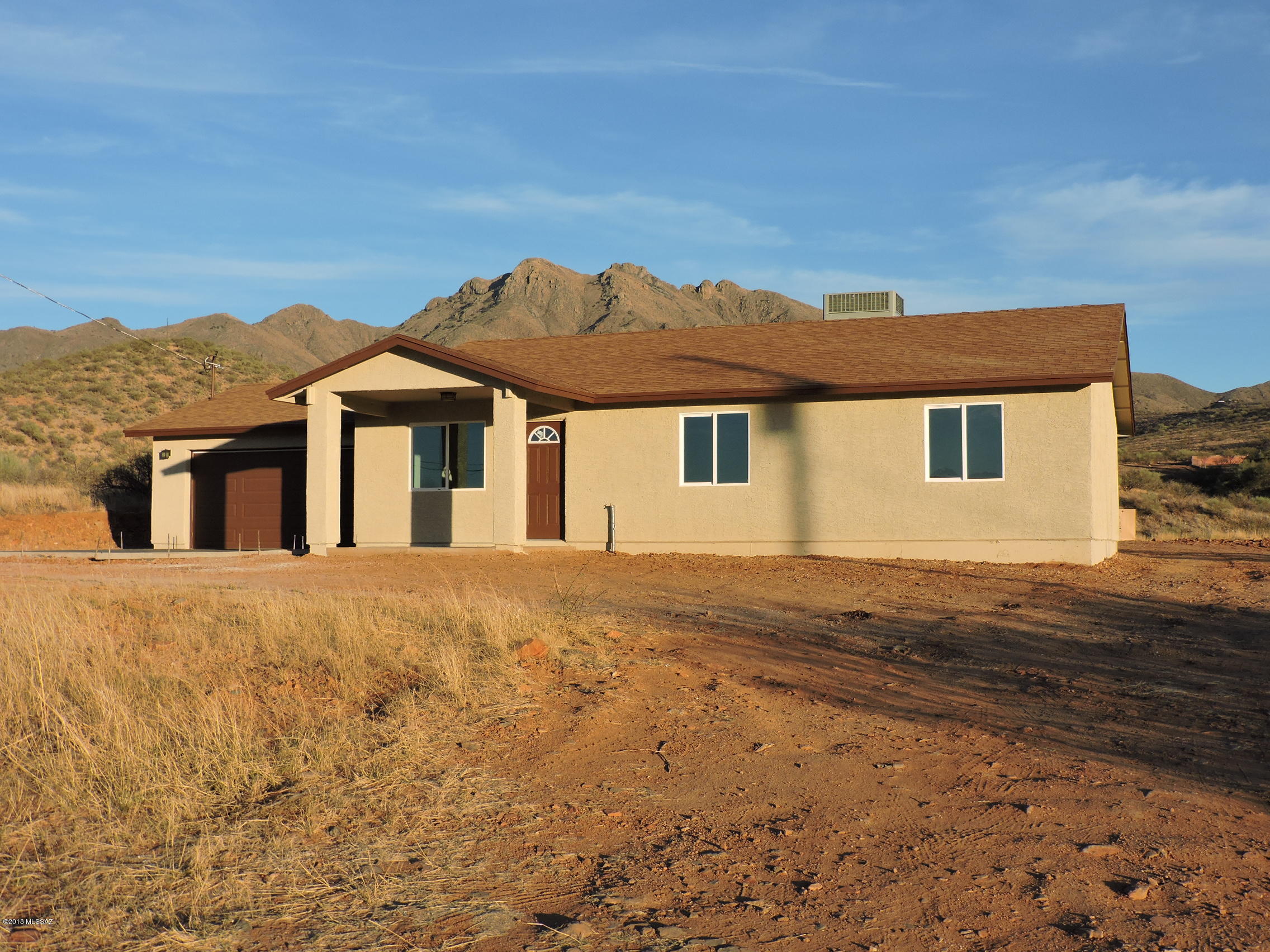 This home is brand new ready to move into. It is in a great location in Northeast Rio Rico. Terrific views and private cul-de-sac location makes this a must see. Upgraded cabinets, tiled floor throughout, cathedral ceiling and fans in every room. Master bedroom has a walk-end closet, cathedral ceilings and great view. Enjoy the view of San Cayetano from you cover back patio. Over a half acre with plenty of room in the back for RV parking. Off of Pendleton Drive and minutes to freeway, plus close to new fire station on Ruta Cameron.