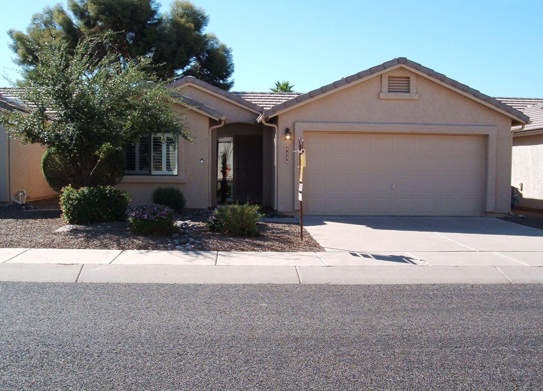 Lovely and inviting,with tile floors throughout, an added den/AZ room, screen room, nice  back yard with automatic awning, this home also includes most furniture and all appliances, including new water softener and reverse osmosis. A great home in a fabulous 55+ gated community with pool and spa plus access to all the activities and amenities of adjacent Voyager RV Resort, including restaurant, pickle ball, day spa, fitness center, classes, entertainment and lots, lots more. A definite must-see!! Welcome home to the active adult lifestyle.