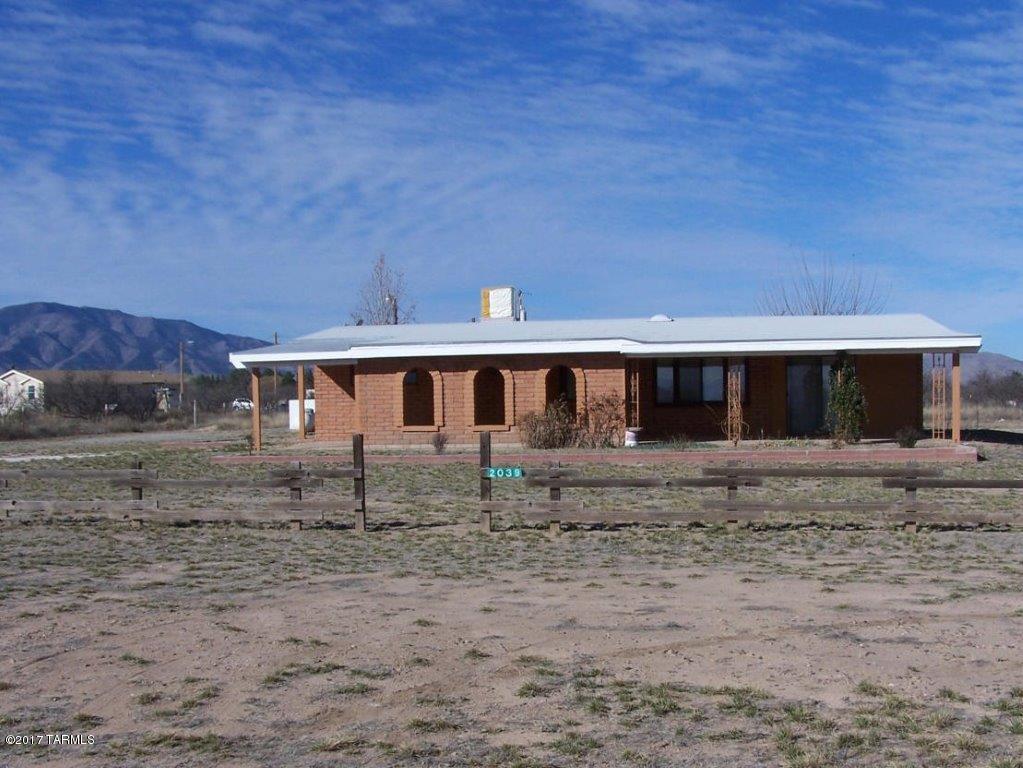 Comfortable adobe hacienda makes for a  country get away. Beautiful tile counters in the kitchen. Ceramic tile floors through out.   Super clean and well maintained home. Remodeled in 2014. Workshop with electricity, a real log cabin that would make a great man cave. On 1.1 acres with full RV hook-ups, washer/dryer hook-ups in 3/4 bath. Private well, new pump in 2014. Propane tank and septic system. Not in a flood zone.