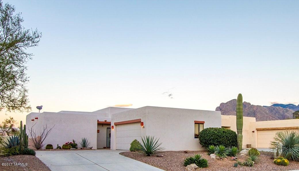 Beautiful home of Integra masonry block construction. 3rd bedroom currently used as den/office. Incredible Mountain Views from the patio and yard. Adjacent to 12 acre private, fenced desert park owned by the HOA with 1.4 miles of trails. Community lap pool, spa, and playground. Quiet enclave of 39 homes.  Newly remodeled hall bath has new Jacuzzi tub, vanity, sink, toilet, paint and tile. Great location with easy access to Pima Community College, Public and Private schools, YMCA, Churches, Hospitals, Public Library, Golf, River Park, shopping and more. Floor Plan in both Photos and Documents. This is a beautiful home in a great community!