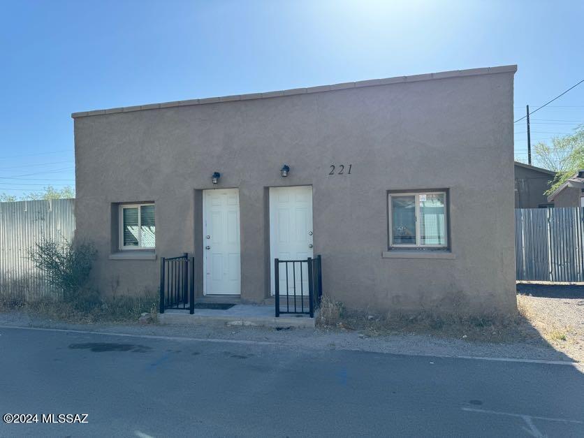 Wonderful location with easy access to the U of A, Pima Comm College & Downtown. Home is located in the historic Dunbar Springs neighborhood and features modern living in this 2 Bedroom/1 Bath home. Updates include a wonderful Kitchen with lots of Cabinets, SS appliances - Range, Microwave, Refrigerator, Dishwasher and large pantry closet. Updated Bath with tile floors, tiled walk-in shower, executive height vanity, and large linen/storage closet. Spacious bedrooms with ample closets & ceiling fans. Central HVAC system, tankless water heater & laundry room with storage and Washer/Dryer. There is 1 off street parking area. Owner provides Water/Sewer/Trash. The 3 Amigos enclave features 3 homes that share an interior courtyard & yard. Community Garden right down the street. Move right in!