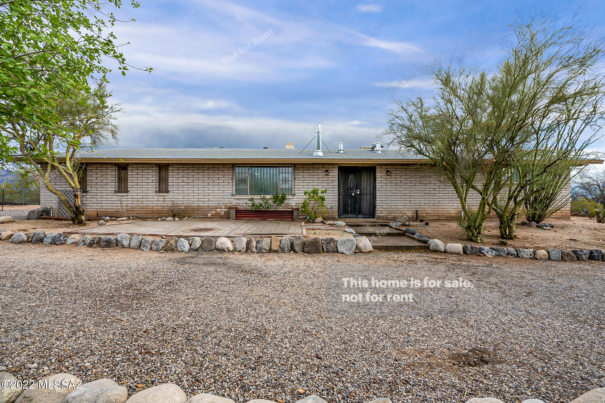 This Tucson one-story corner home offers a two-car garage. This home has been virtually staged to illustrate its potential.