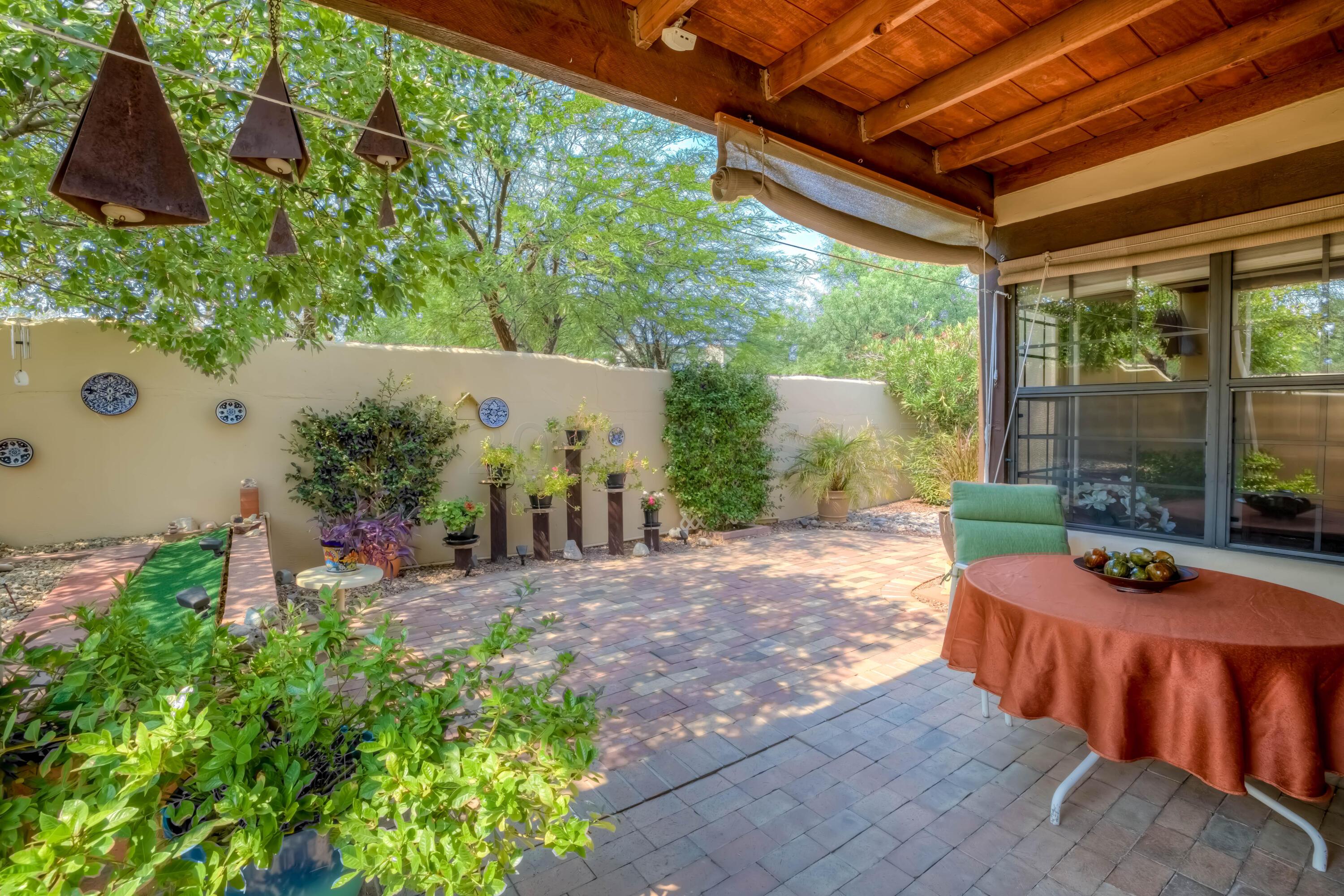 Situated in the heart of the sought after Old Fort Lowell District, this charming stand-alone home in La Sonrisa enclave has a Spanish Colonial vibe & features: large, welcoming great rm w/ gorgeous, rough-sawn beam/corbel ceiling, Saltillo floors (no carpet) & French doors leading to a lush, private yard w/ a brick covered patio for year-round indoor/outdoor living.  Live a healthy lifestyle - WALK to Ft. Lowell Park, community pool/spa, Tucson Loop Trail, TMC, Plaza Palomino, Whole Foods or the numerous walking trails along Bosque Ranch. Fabulous Old Fort Lowell Neighborhood Community Group. Enjoy Catalina Foothills mtn views from the kitchen. New interior paint, new water heater. This immaculate 2 bd/2 ba property is sited on a corner lot and exudes Tucson charm!