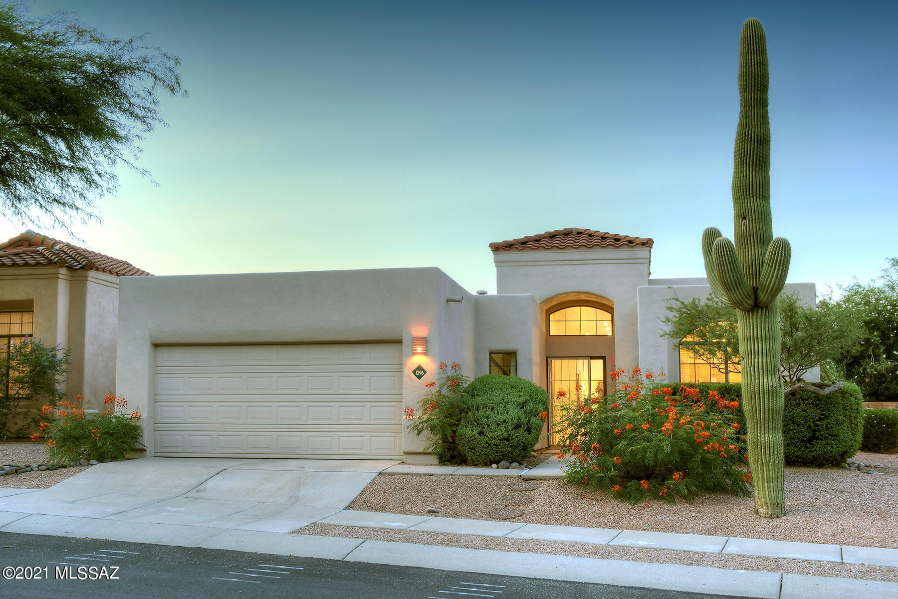 WELCOME to the DESIRABLE Neighborhood of 'THE HILLS'' conveniently located in the near NW Side. Move-in ready, SINGLE STORY Contemporary offering 3 Bedrooms, 2 Baths & 2 Car Garage. This STUNNING ''Light and Bright'' home is Beautifully UPDATED featuring OPEN Great-Room CONCEPT with gorgeous TRAVERTINE floors in all living spaces, STACKED STONE Gas Fireplace & HIGH CEILINGS. You'll find a Gourmet COOK's Kitchen with Stainless Steel Appliances, Plenty of Cabinetry, Pantry, Breakfast Bar & Nook. The Master Suite boasts Dual Vanities, Walk-in Shower & WALK-IN CLOSET. HVAC/Water Heater/Appliances/Ext Paint: 2020. The Large PRIVATE Backyard has a COVERED PATIO & is a True SANCTUARY - Perfect for Entertaining! Steps away to the community pool & spa. Close to food & shops. Seller related to agent