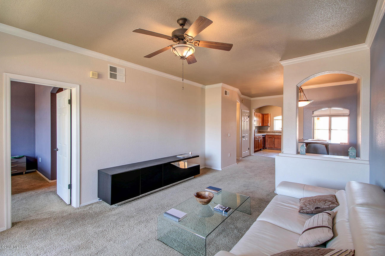Beautifully spacious 2 bed 2 bath upgraded Catalina foothills area Condo in highly desirable Pinnacle Canyon Condo Community! Not every condo in the community has a garage. This on does! Your family will love this private, quiet 2nd story unit which features: modern LED lighting, detached garage, Nest Thermostat, New modern stainless steel kitchen-Aid Appliances & wine fridge, & wonderful mountain & courtyard views from private balcony! Your family will create endless memories in this condo community which is located just 1.5 miles from Sabino Canyon Park & has resort style amenities such as large heated pool & spa, exercise facility, grand clubhouse, BBQ areas & much much more! Italian furniture from Copenhagen Imports can be purchased on a separate bill of sale.