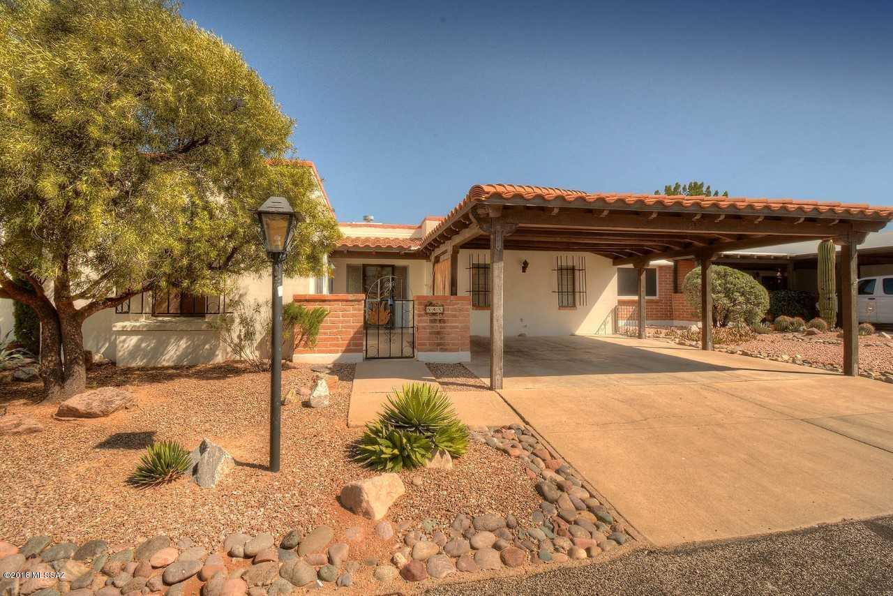 Charming 2 bed 2 bath townhouse in Townhouse 1V with dead on Mountain VIEWS from the paved back patio! Located in the heart of Green Valley, this townhome has NO GVR. Huge tiled and enclosed Arizona room has been added on to enhance the living space and capture those views! Running the entire length of the house, this room could be the inspiration for you crafts, an inviting library/media room, or elegantly entertaining your winter guests! Beautifully paved back patio with gorgeous views of the Santa Rita mountains creates the outdoor living space you've been dreaming of. Spacious living room features authentic bee hive fireplace to warm the ambience on those chilly desert evenings. The dining area is included in the living area and also takes advantage of the fireplace and views. A comfortable kitchen features breakfast bar, large breakfast nook, new refrigerator, laundry closet and lots of windows to bring in the sunshine. Both the master suite and guest room have direct views of the mountains through sliders leading out to the Arizona room.