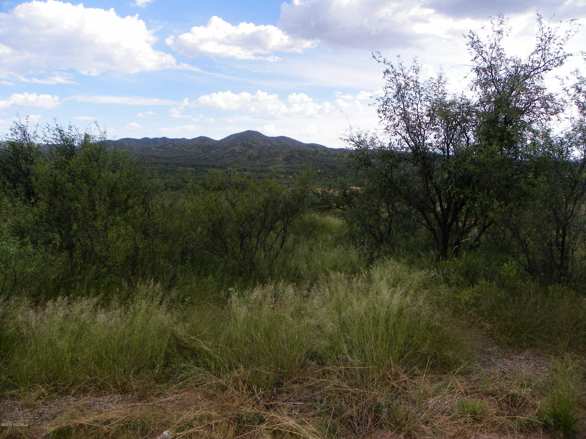 Lot is at the end of the cul-de-sac. Paved road, electric and water at the street. Nice views.