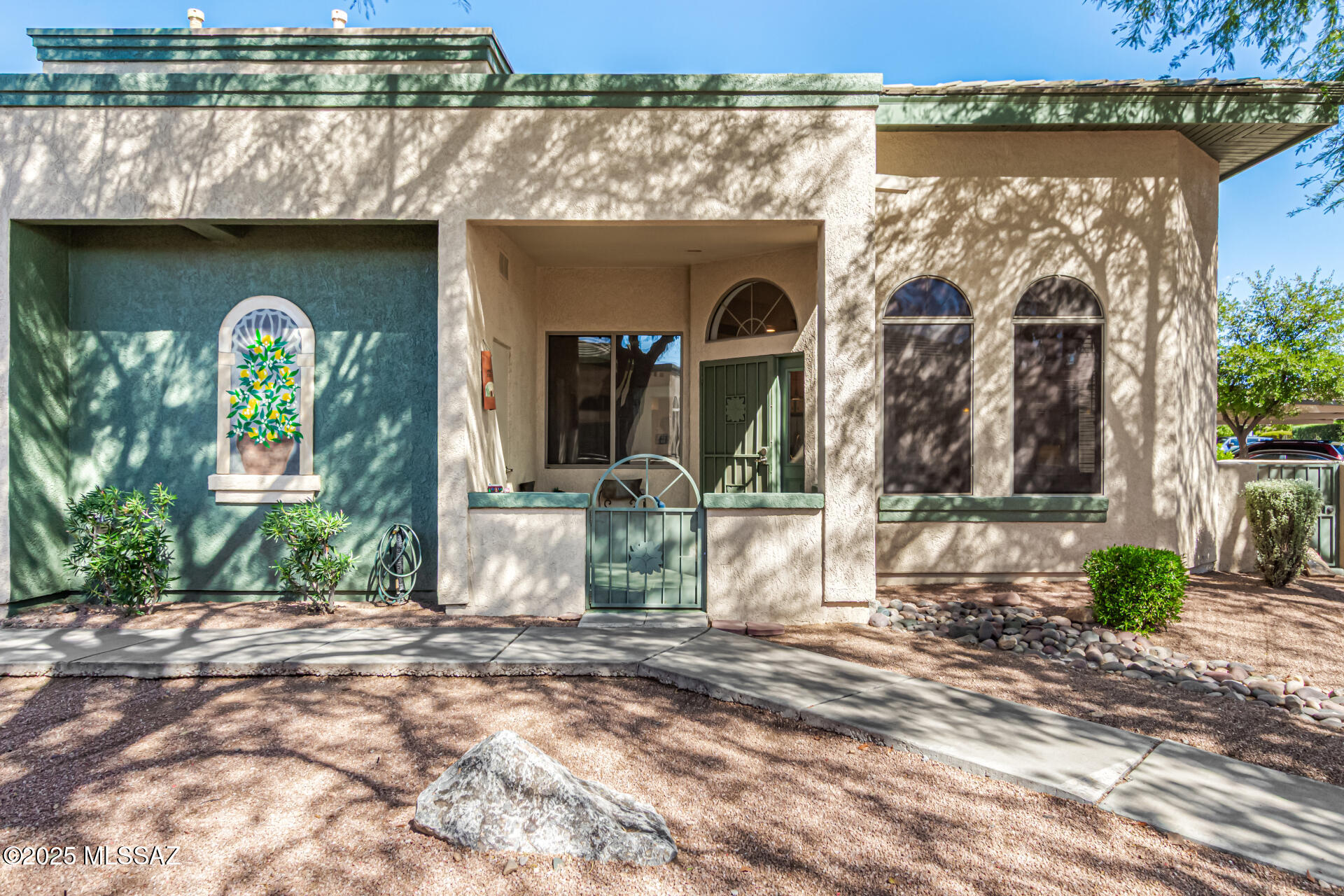 Enjoy Resort Style Easy Living 55+ Community which offers Gated Entry, Pool, Spa, Rec Center; HOA covers, Water, Waste pickup, Community Landscaping, Exterior Stucco & Paint, Tile roof, and Community Street maintenance. Property comes with all Appliances, Freshly Painted interior, Custom Painted Kitchen, Quartz Kitchen countertop, Tile floor throughout the living areas, Bedroom with 2 Walk-in Closets, Bathroom newly Upgraded: Walk-in shower w/Tile surround, New fixtures, New Vanity, New lighting. This unit is located near it's covered parking space as well as a disable parking spot.  It's a short distance from the mailbox cluster as well as the community Pool/Spa and Rec center.  The Community is located near so many amenities: Restaurants, Shopping, Ann Day Community Park, Dog Park, Medical facilities, Short Distance to Pima Community College NW campus, the YMCA, Bike loop & I-10 .