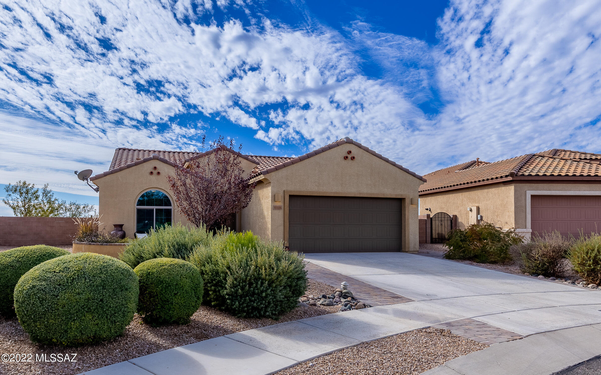 Exceptional Del Webb 55+ Home with VIEWS! Built in 2017 this seasonally used home has 2 Bedrooms, 2 Baths, and large private yard that is situated on a 10,411 square foot lot that overlooks the Pantano Wash from the higher elevation. With all the upgrades- 2.5 stall garage, garage sink, tankless water heater, water softener, custom window shades, stainless steel appliances, granite counters, and custom lighting. Enjoy the views from the large covered rear patio or from the extended front cobblestone patio- this home front faces North/East to see all of the mountain ranges. Pulte Built with the TEP guarantee of being energy efficient!