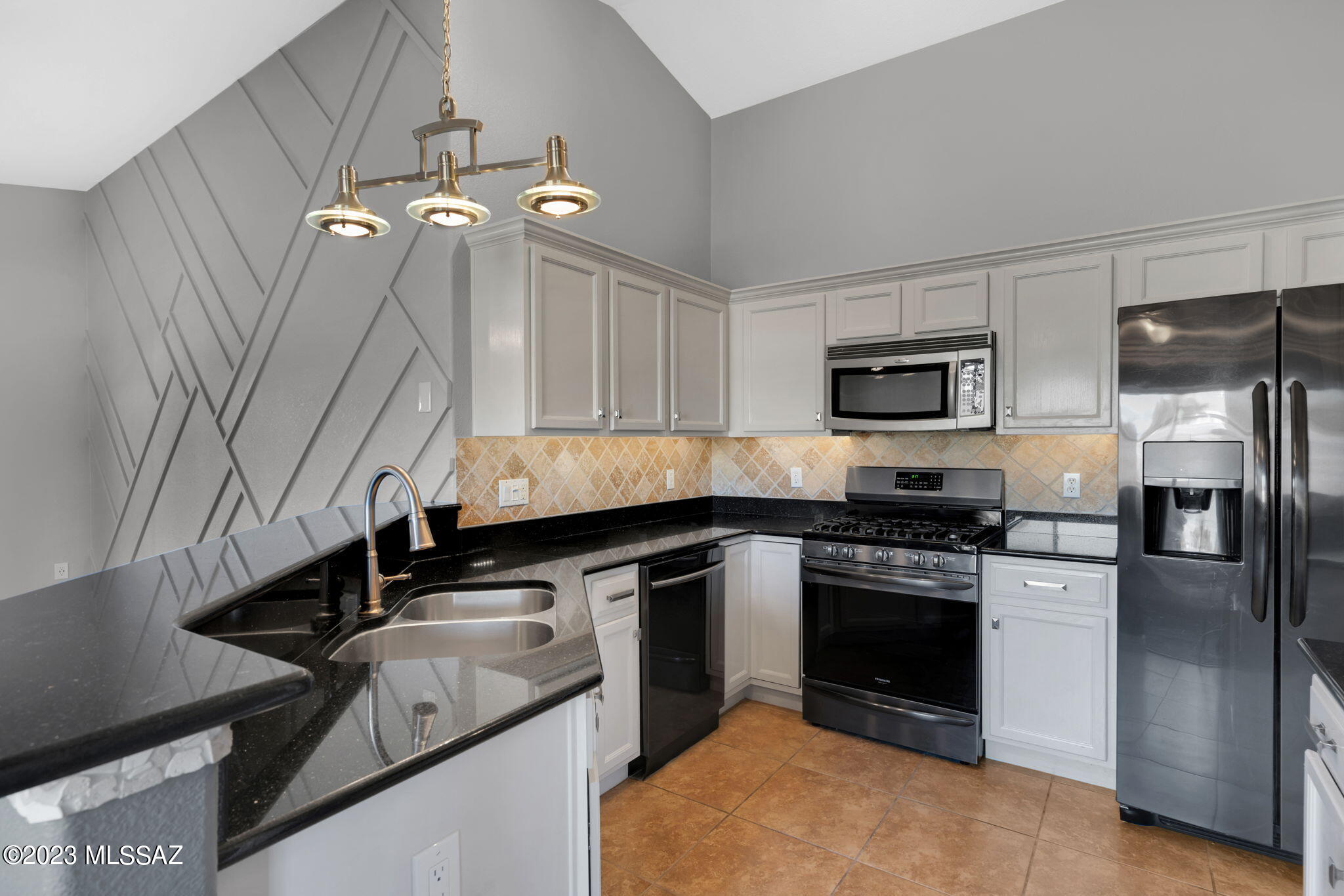 Seller will accept or counter offers between 395,000 and 415,000 dollars. This meticulously maintained home is move-in ready and offers an exceptional opportunity for both first-time buyers and those looking to downsize without sacrificing comfort or style. Located in Quail Crossing near Dove Mountain. This single-story gem offers a perfect blend of comfort, convenience, and style. Situated in a highly desirable neighborhood, you'll find yourself close to schools, parks, shopping centers, and major transportation routes, making daily life a breeze. With 1,495 square feet of thoughtfully designed living space, this home is a testament to modern living. The ample natural light that streams through the windows makes these bedrooms feel warm and inviting. Enjoy the convenience of beautifully upgraded bathrooms. The master bathroom is a private retreat, featuring a contemporary design and modern fixtures for a spa-like experience.
Step inside and be greeted by an open, airy living space that seamlessly connects the living room, dining area, and kitchen. The layout is perfect for both everyday living and entertaining. This kitchen has been tastefully decorated in the heart of the home and features a glass pantry door. With granite countertops, stainless steel appliances, and ample storage, meal preparation is a breeze. The high-top counters provide additional seating. 
Escape to your private outdoor haven, where a meticulously landscaped backyard awaits. The lush greenery, vibrant flowers, and charming patio create the perfect outdoor dining, relaxation, and entertainment setting. Soak away in your hot tub. The attached garage provides convenient parking and storage space for your vehicles, tools, or recreational equipment.