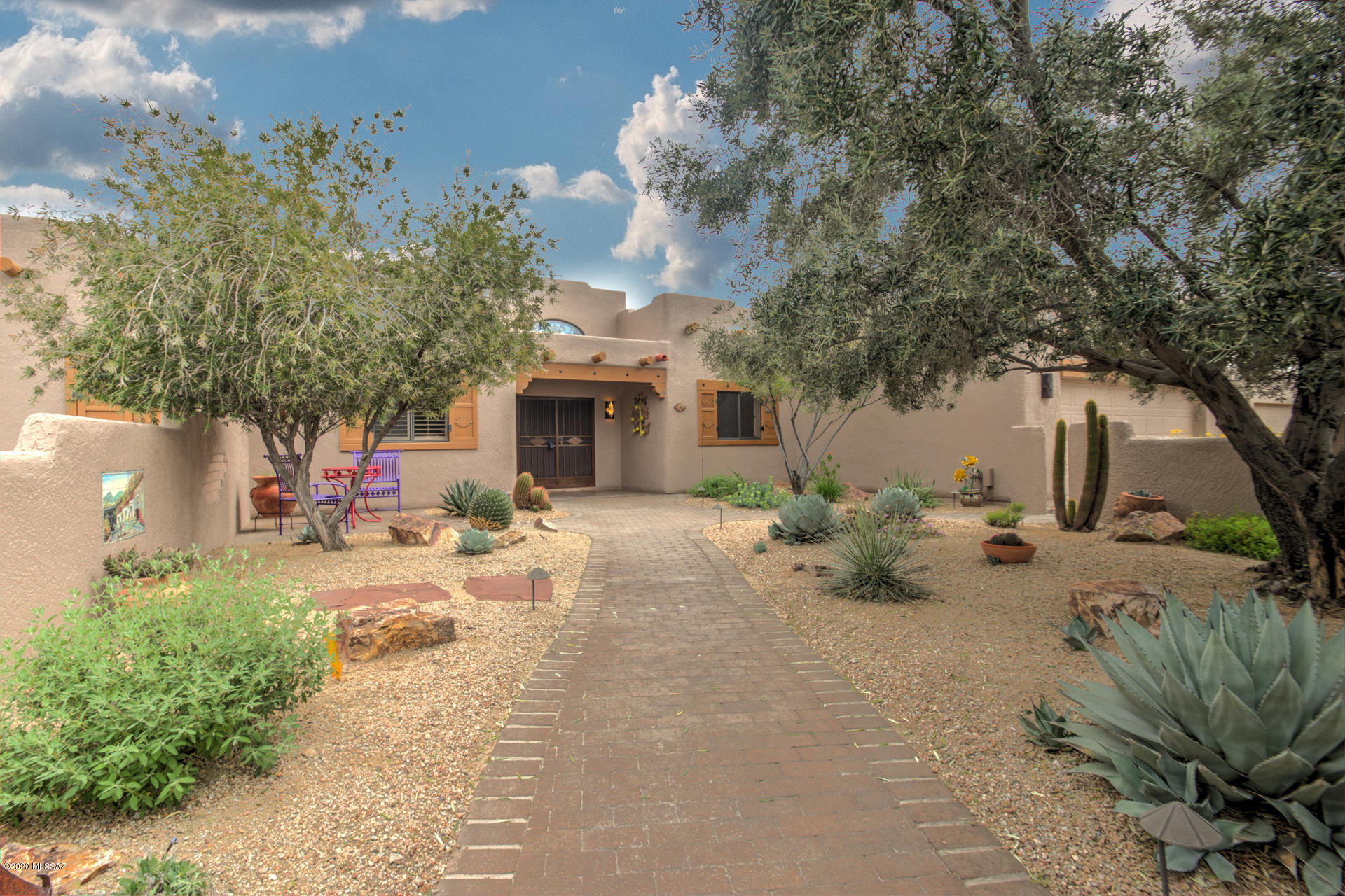 Grand Oasis Right here in Green Valley. This sumptuous 2659 Sq. Ft. is not only grand but also has a spiritual warmth to it. It feels like a glamorous Southwestern Retreat. This one owner Pierce home is located on a beautiful 1/3 acre  and is on a dead end street. This home calls to you even prior to entering. Breath taking, beautiful, and classy with all the accoutrement's not to be believed. The extras as you look from one place to another keep you spell bound. All the extras stay, even the furnishings inside and out including the tasteful window treatments. The Kitchen is a Chef's gourmet dream. Step outside onto the spacious tiered back patio. Sit in front of your built in fireplace and sip your drinks while your steaks are sizzling. Look over the gardens and absorb that pristine mountain view. Don't forget the three car garage with workshop. Extras out side include hot tub and mister hookup. Privacy galore! How do I get my dream home? Buy this decorators' gem.